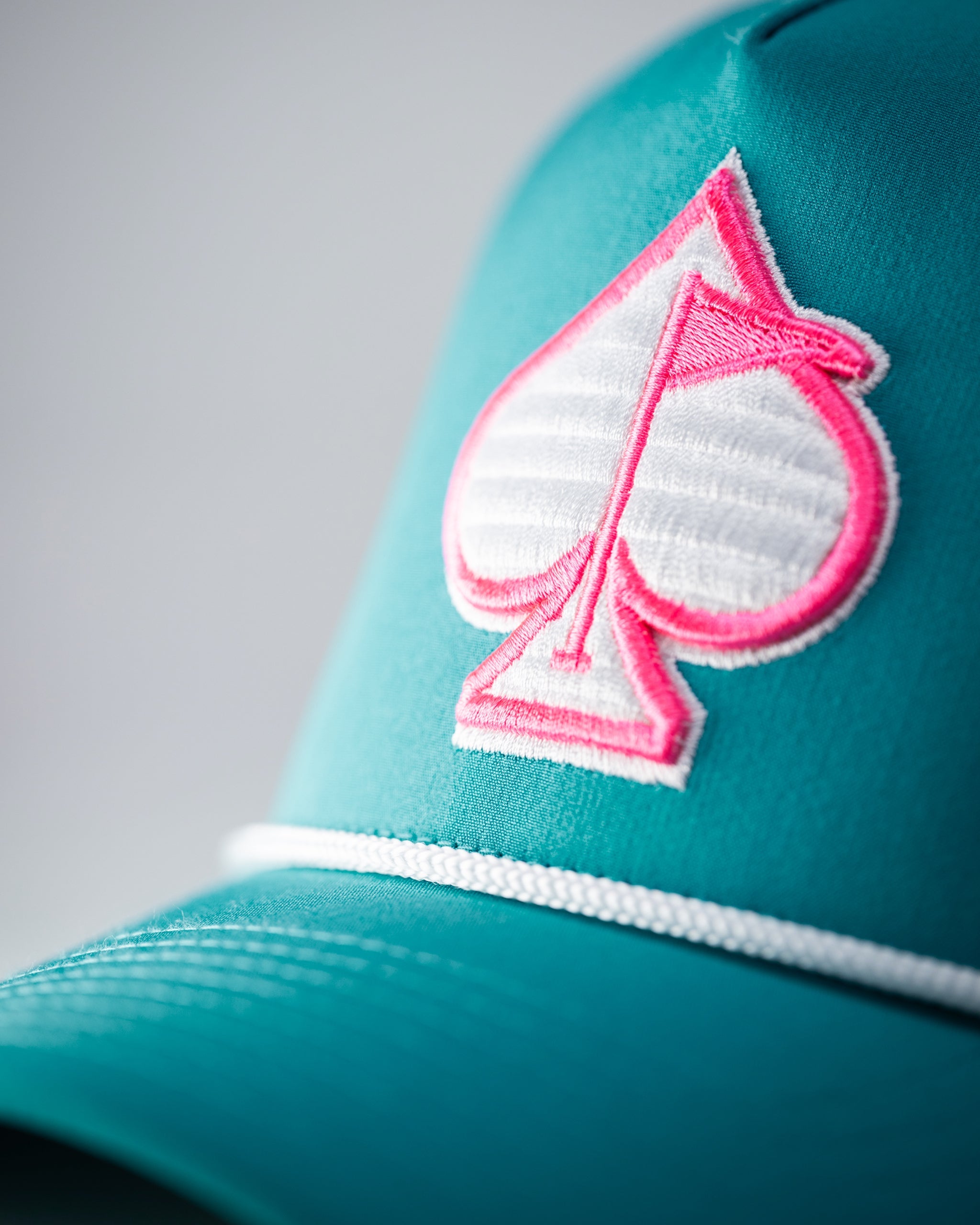 Perforated baby blue rope hat with adjustable chin strap and stylish design.