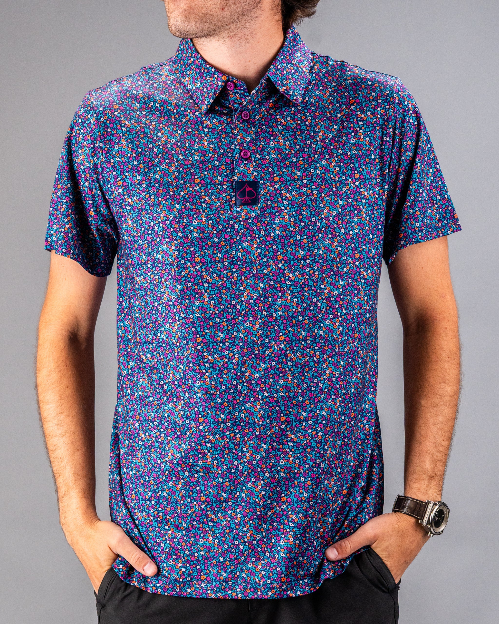 Men's lavender golf polo featuring a vibrant floral pattern, designed for style and comfort on the course.