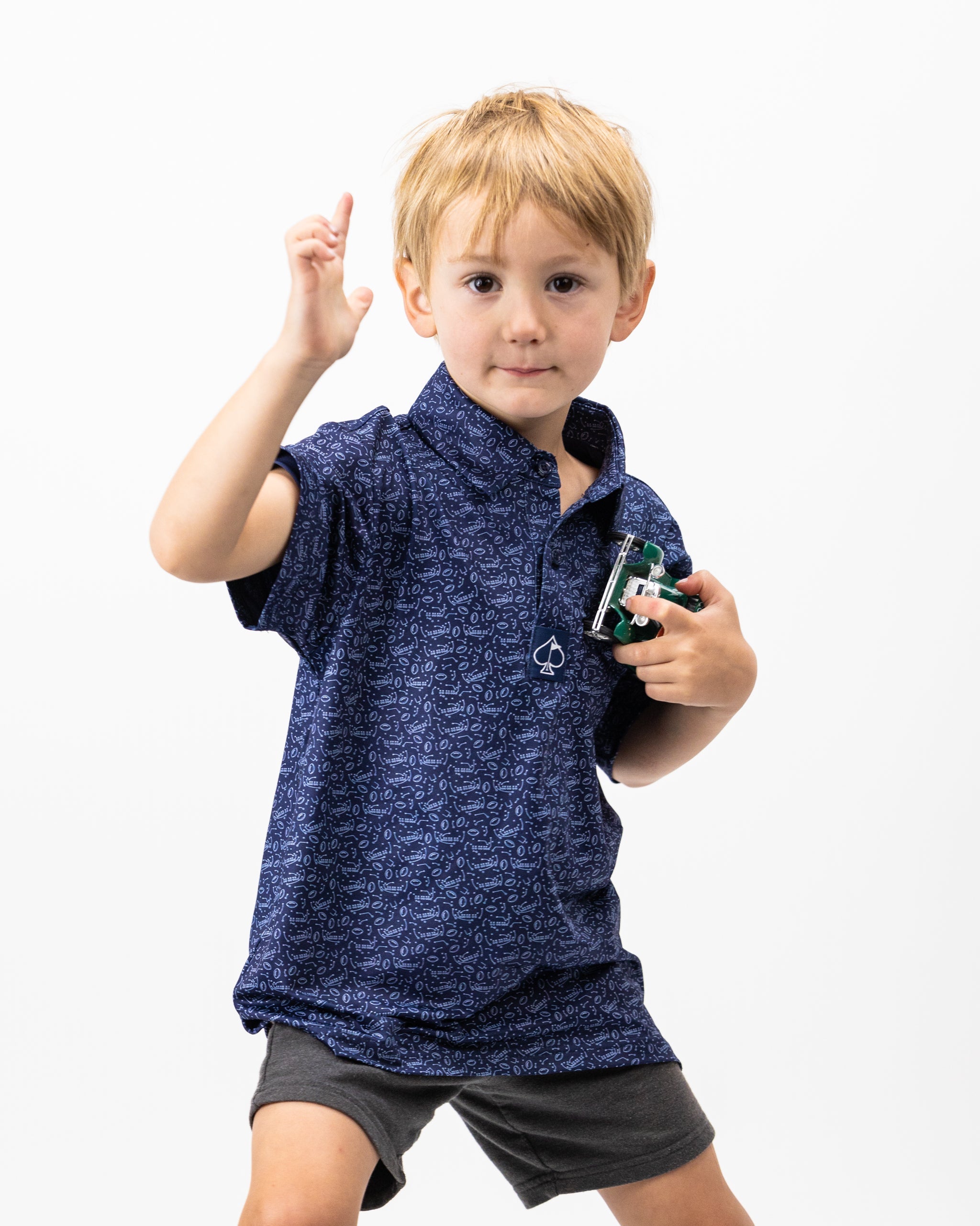 Youth Playmaker polo shirt in vibrant blue, featuring a stylish design and breathable fabric, suitable for active children.
