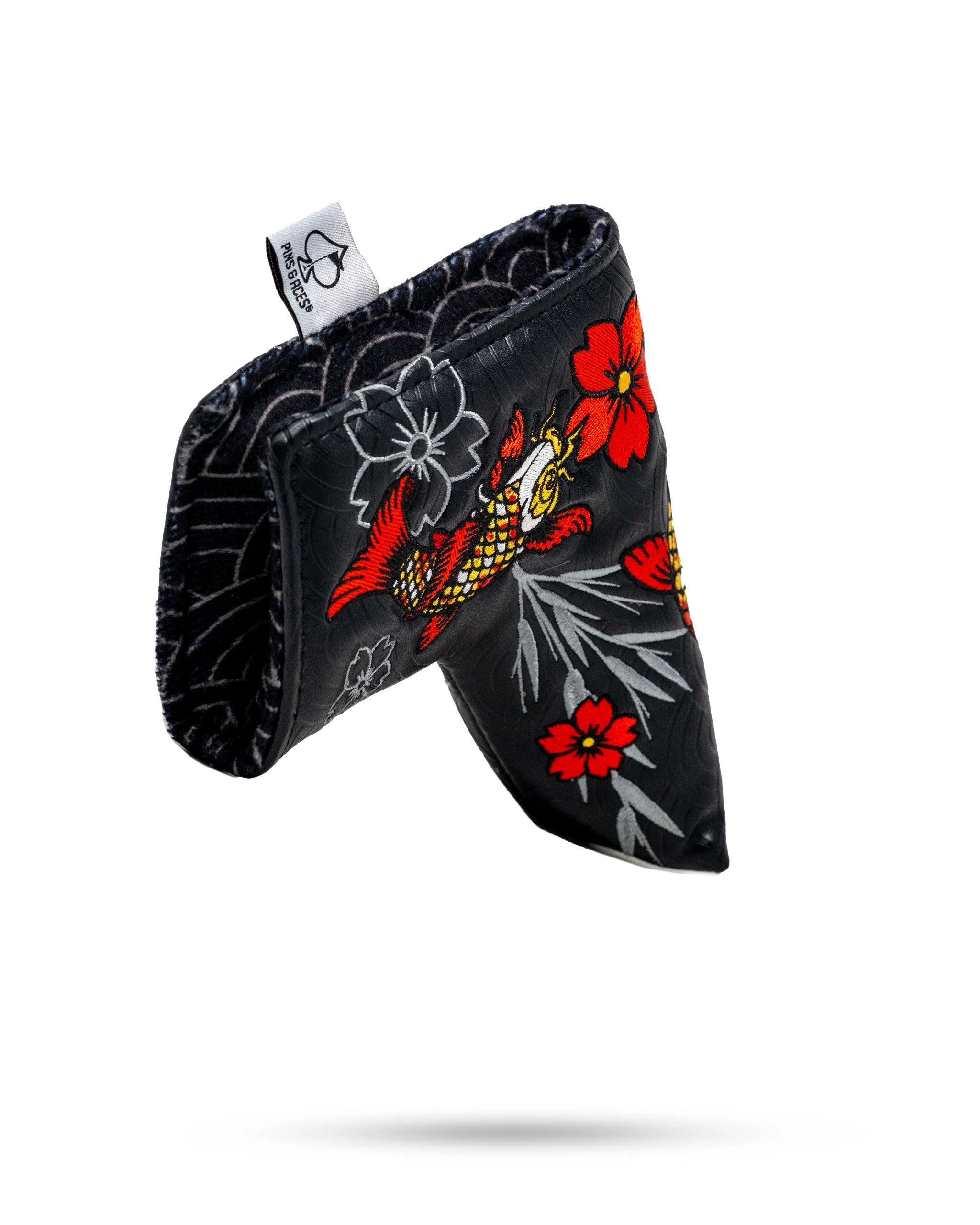 Koi Flow Blade Putter Cover featuring a vibrant fire waves design in shades of blue and orange.