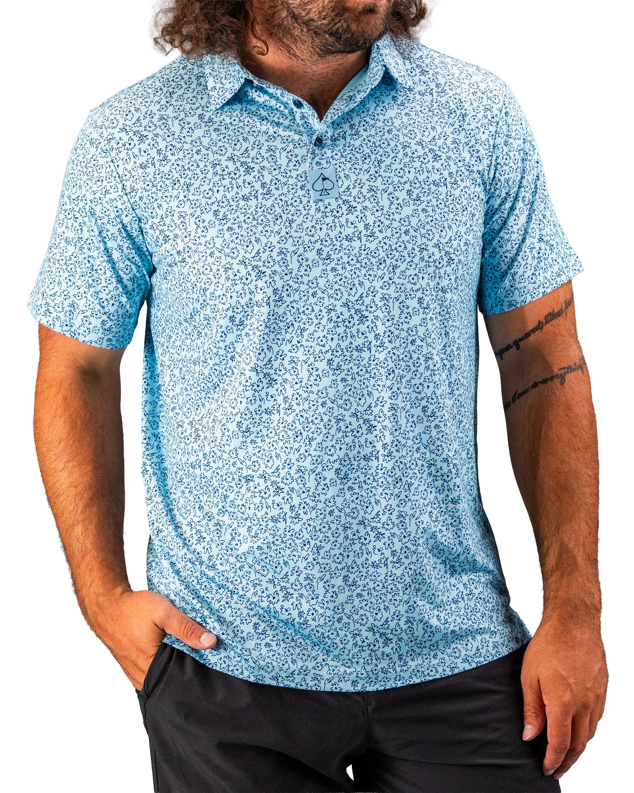 Men's short-sleeve golf shirt in light blue featuring a floral doodle pattern, designed for a stylish and comfortable fit on the course.