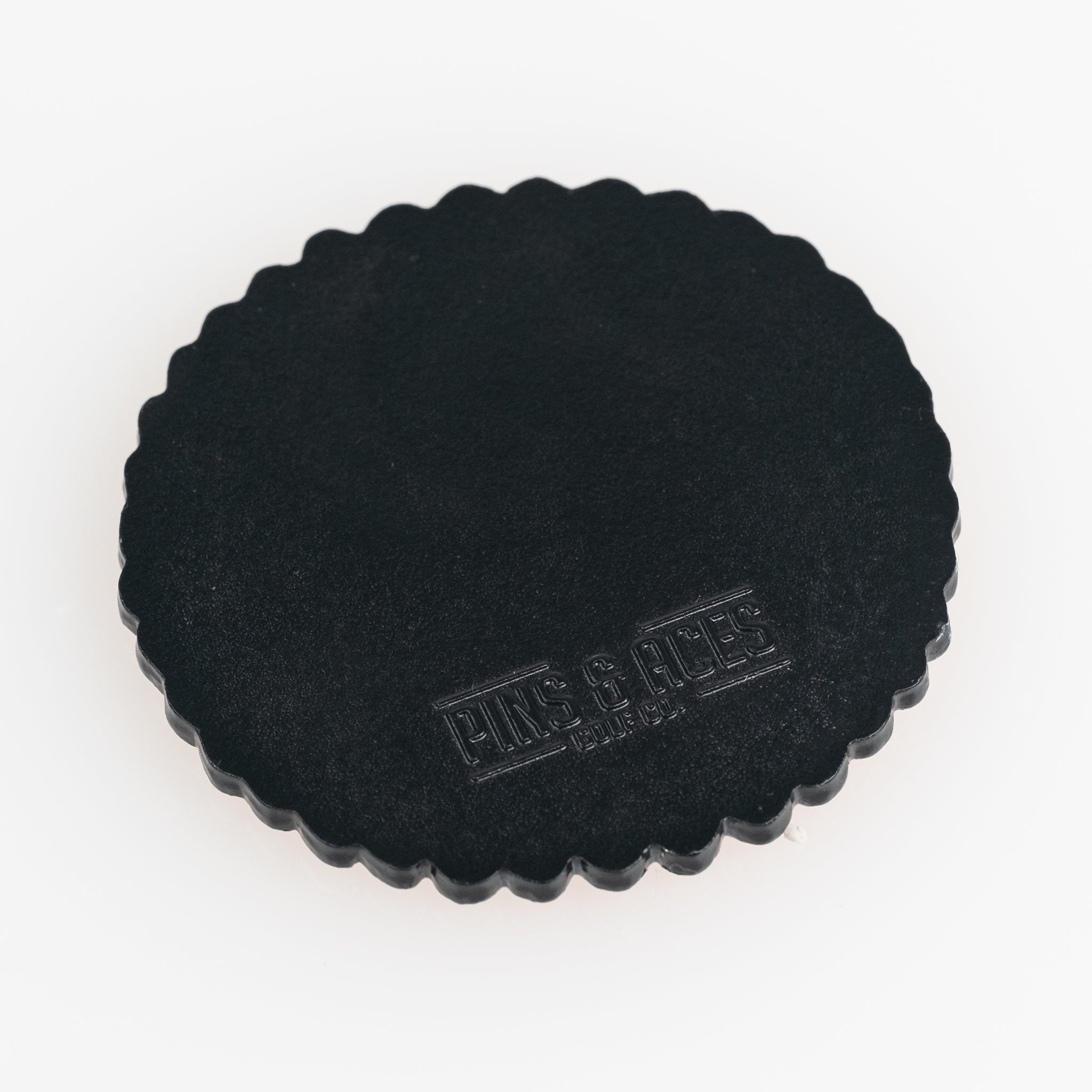 Gilmore Cracker Ball Marker featuring a vibrant design inspired by the Happy Gilmore movie, showcasing a unique circular shape with the brand logo.