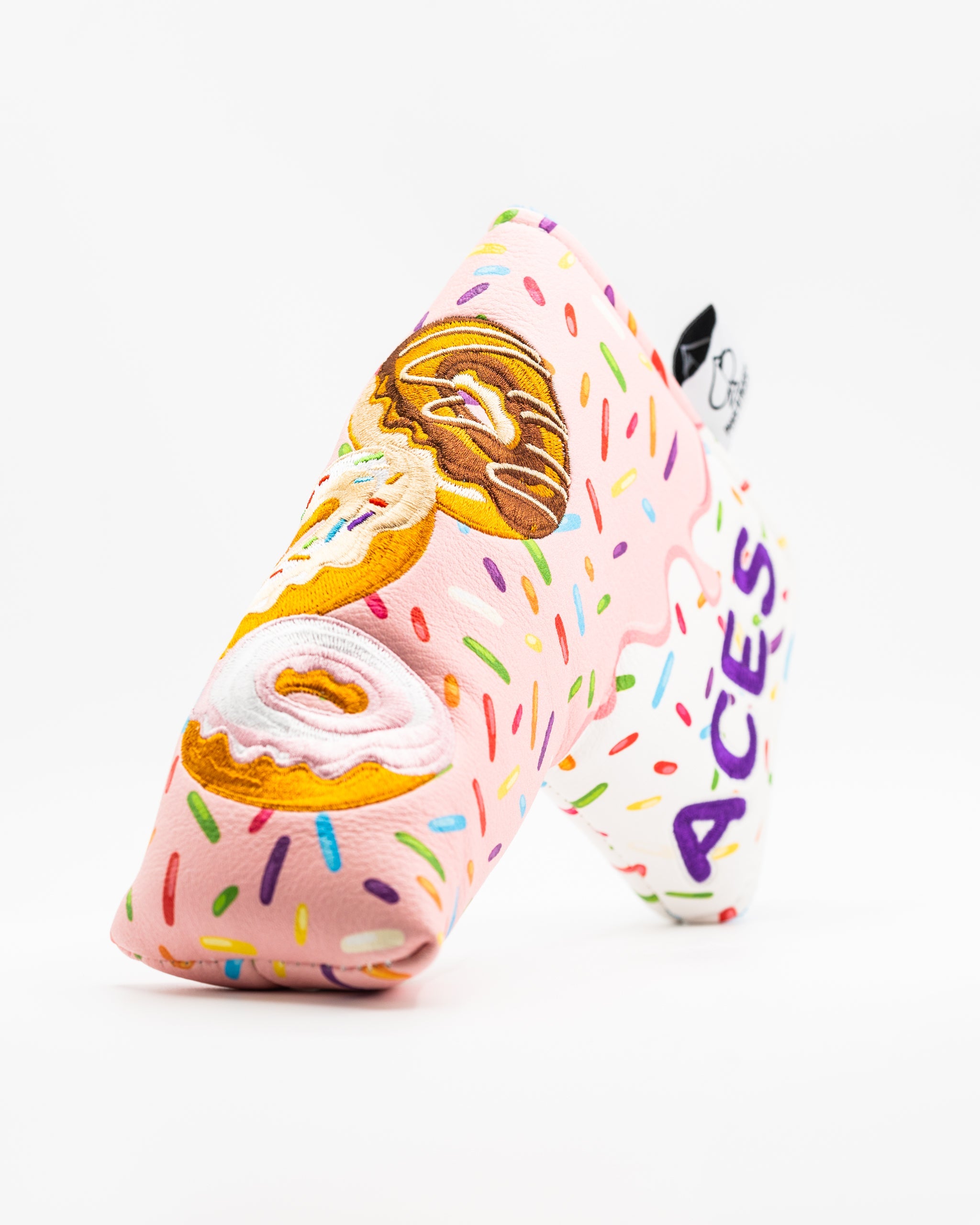 Colorful blade putter cover featuring a donut design with sprinkles and the word "ACES" in bold lettering.