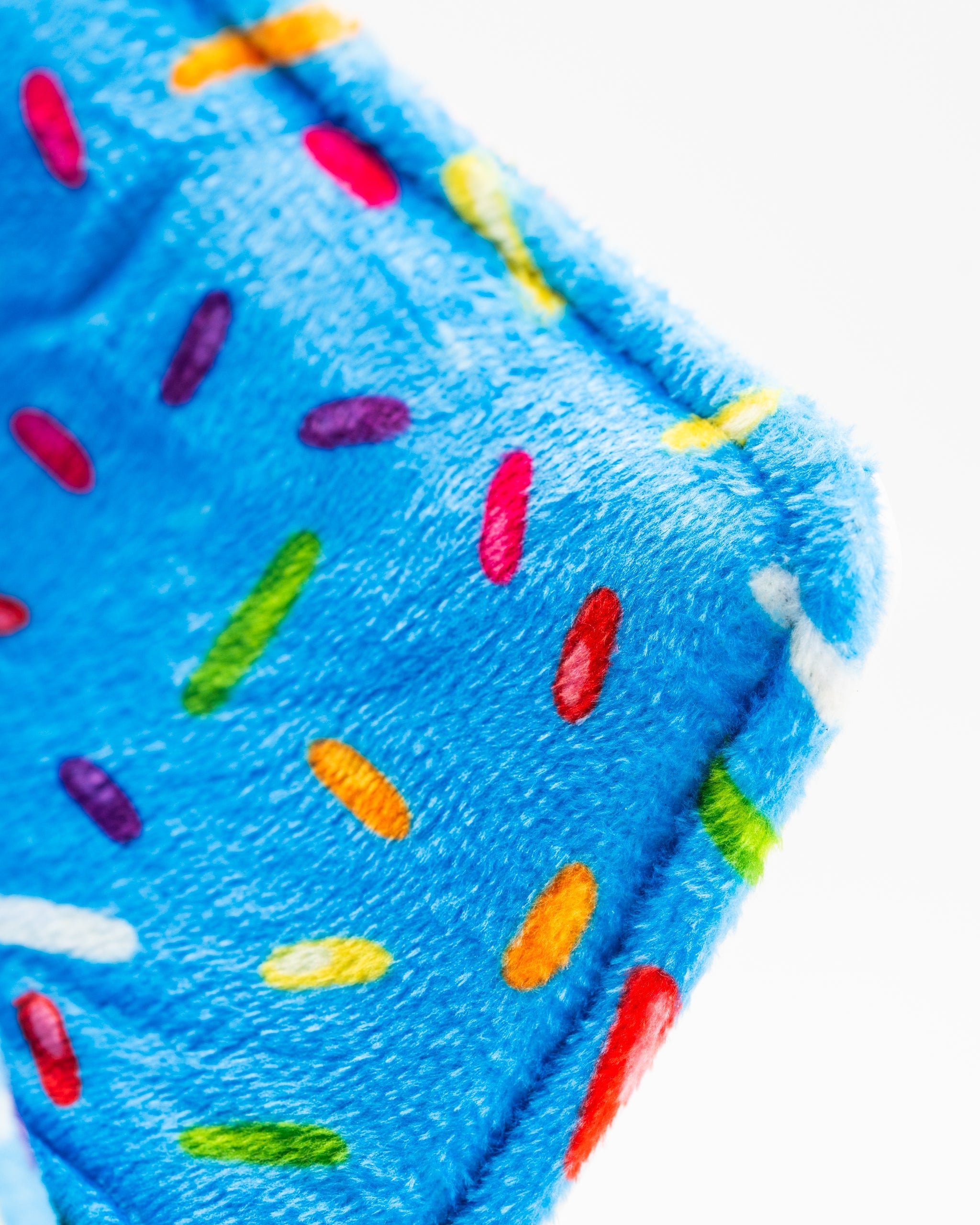 Bright blue blade putter cover featuring a playful sprinkle design, perfect for adding fun to your golf game.