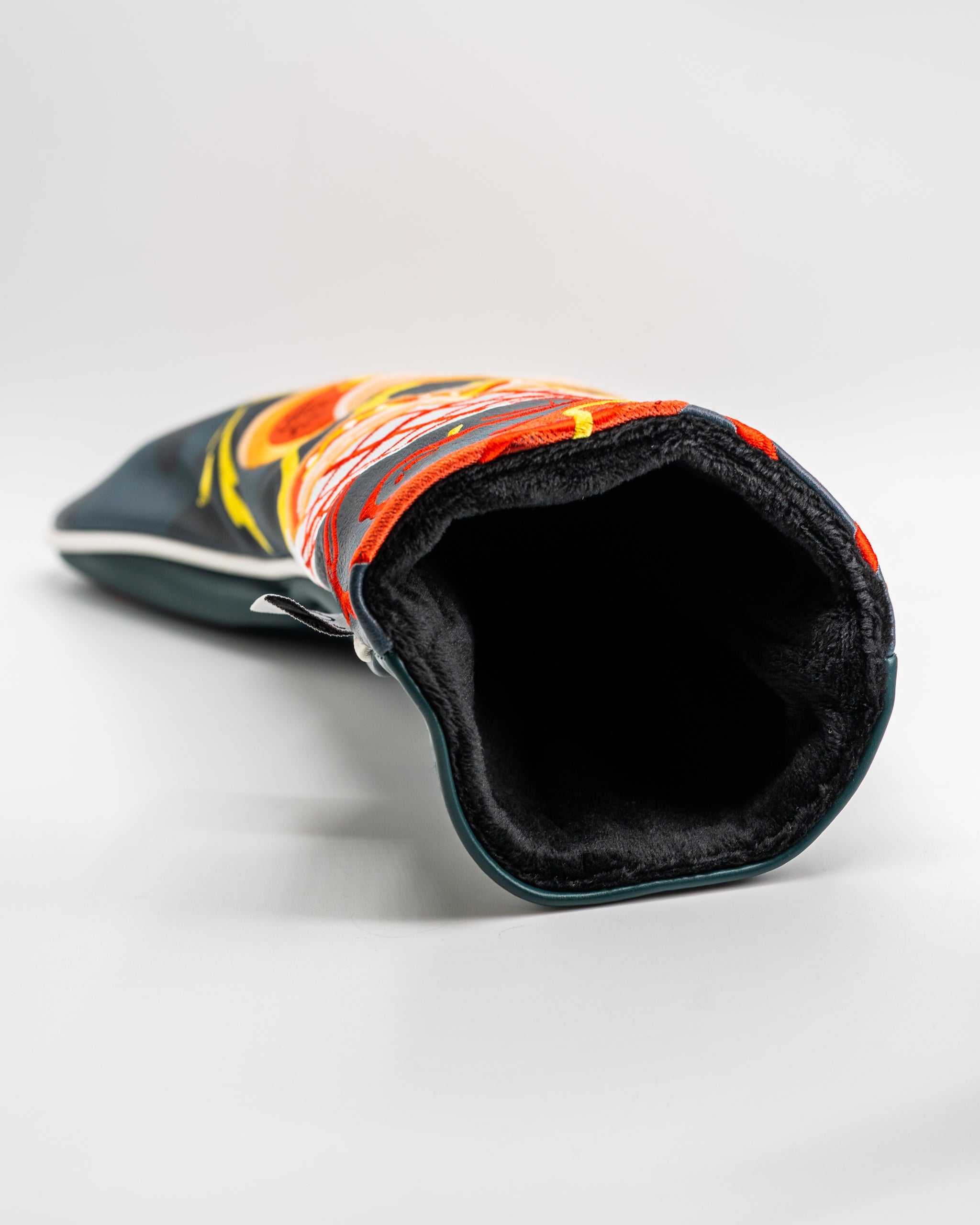 Bold driver cover featuring vibrant hot dog design and plush interior for protection and style on the golf course.