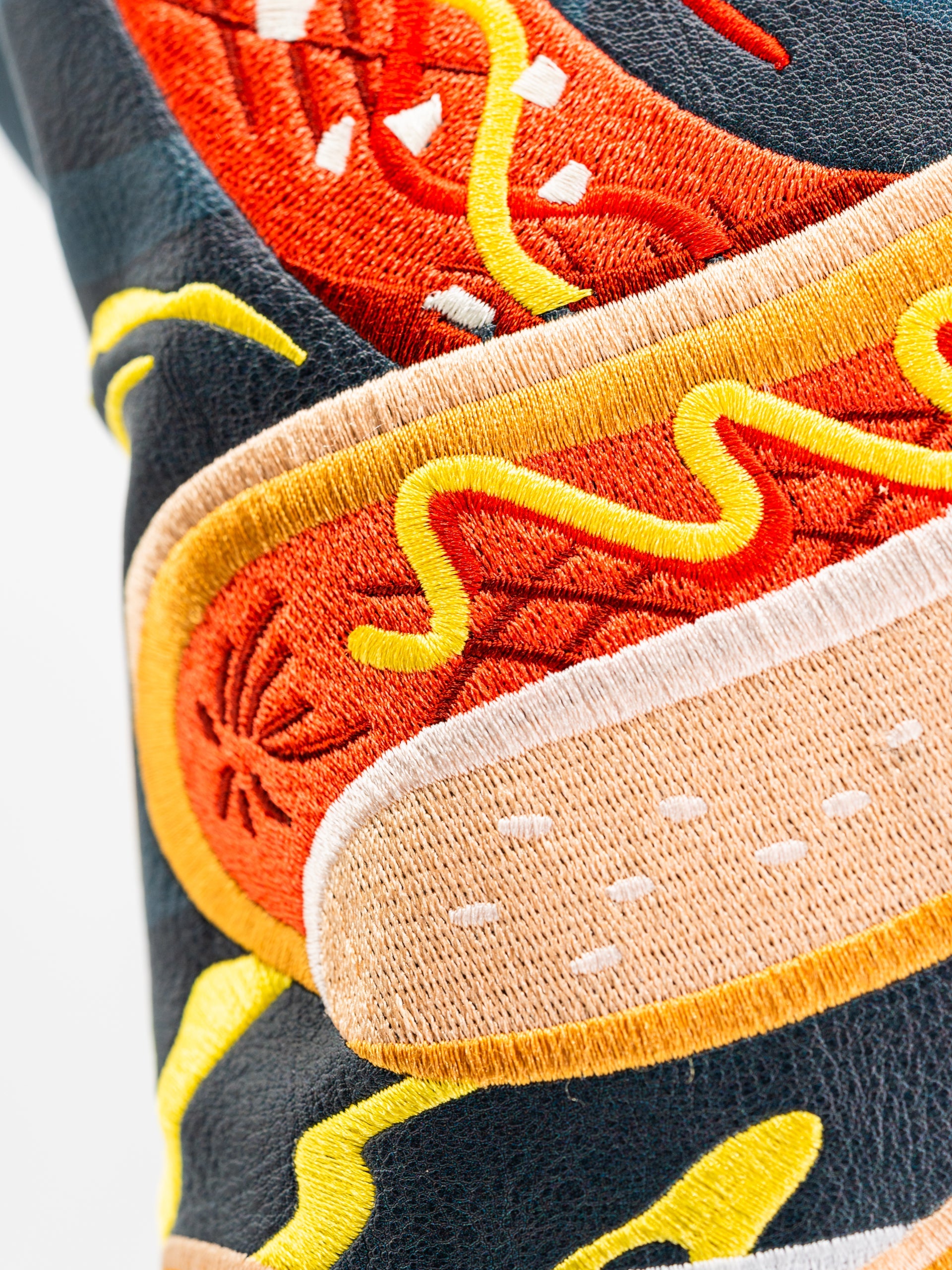 Bold driver cover featuring vibrant hot dog embroidery with mustard and ketchup details, perfect for standout golf style.