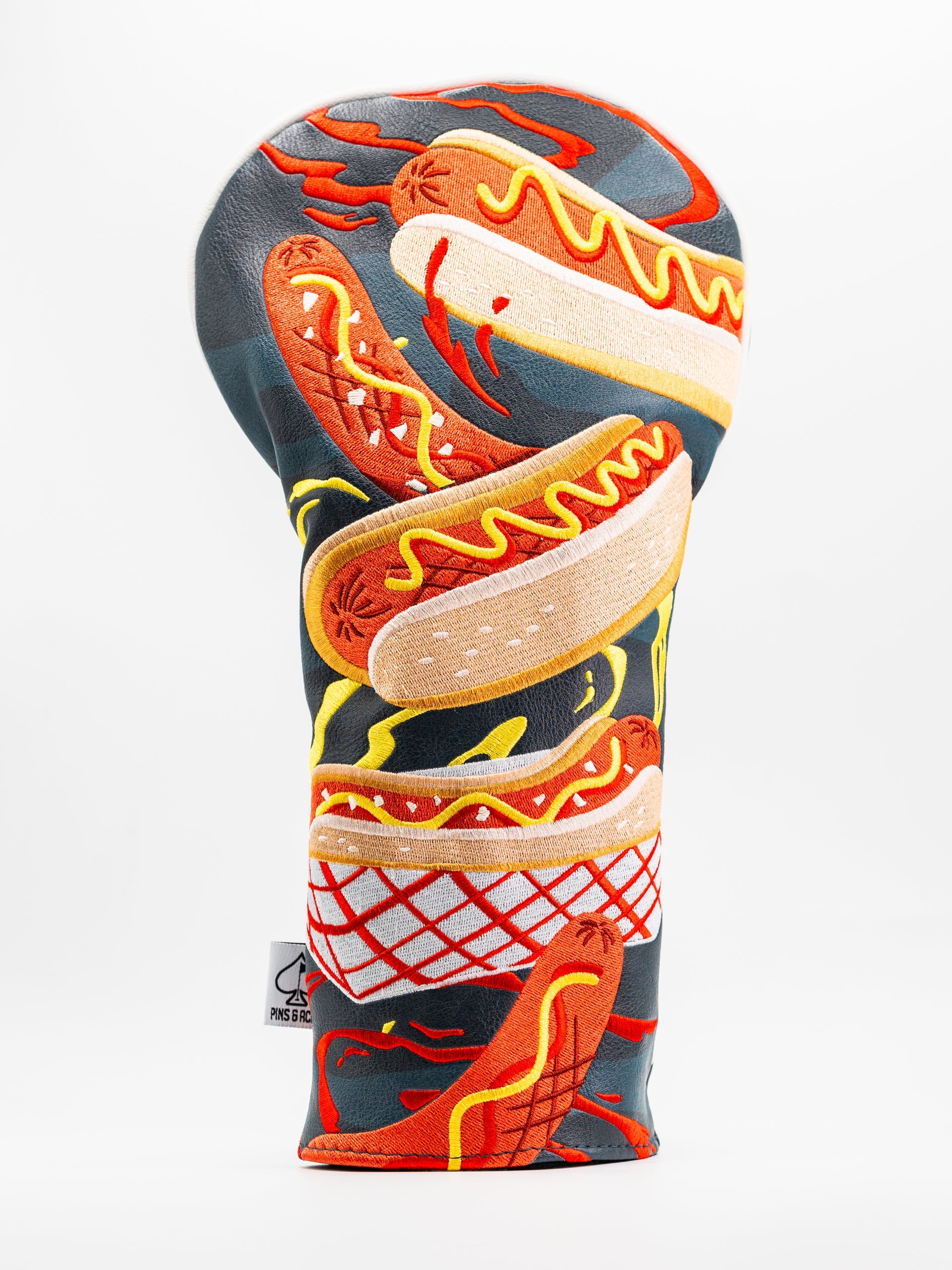 Colorful driver cover featuring a playful design of stacked hot dogs with mustard and ketchup accents.