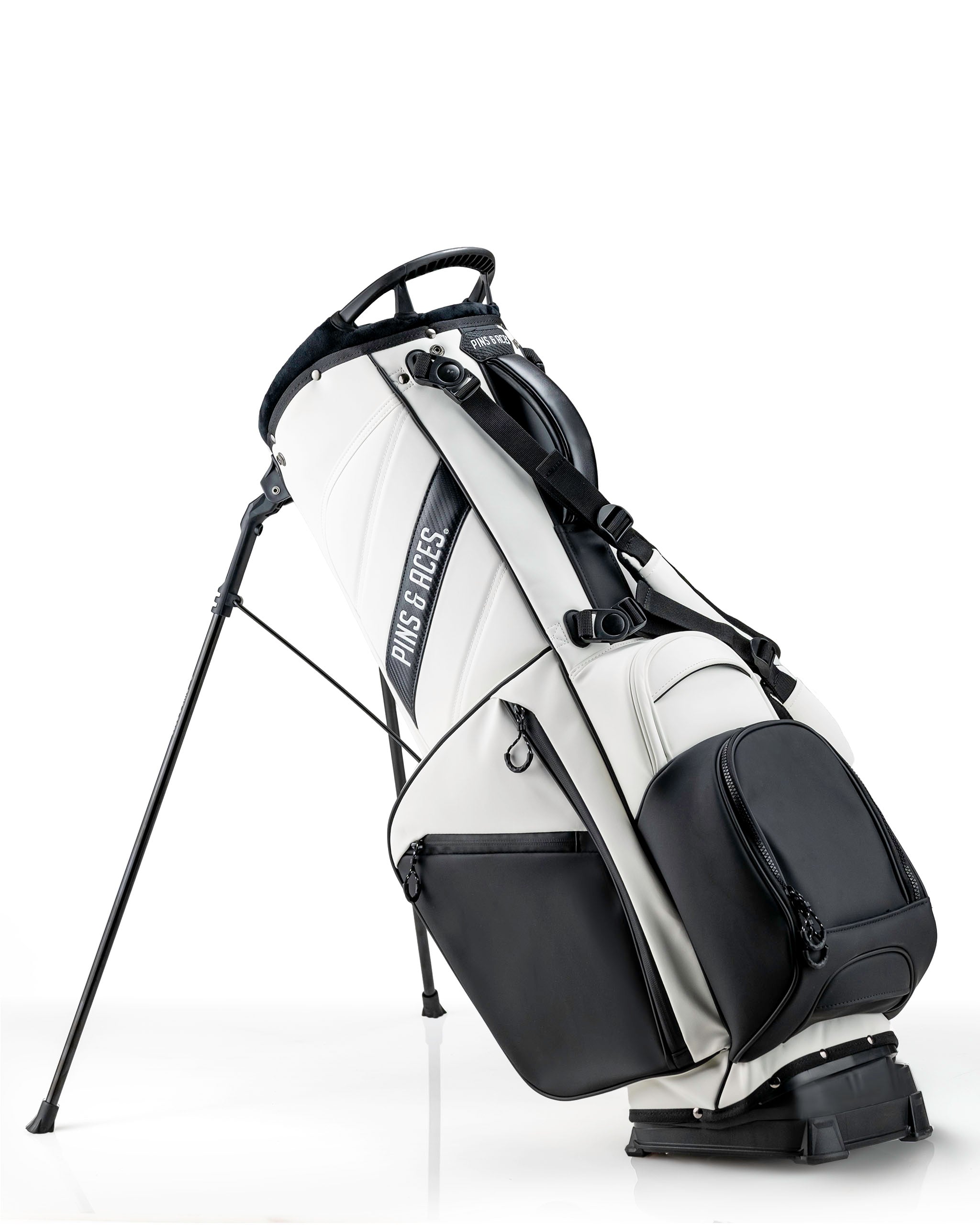 Player Preferred™ Golf Bag in Domino design, featuring a sleek black and white pattern, multiple pockets, and a padded shoulder strap, suitable for golfers.