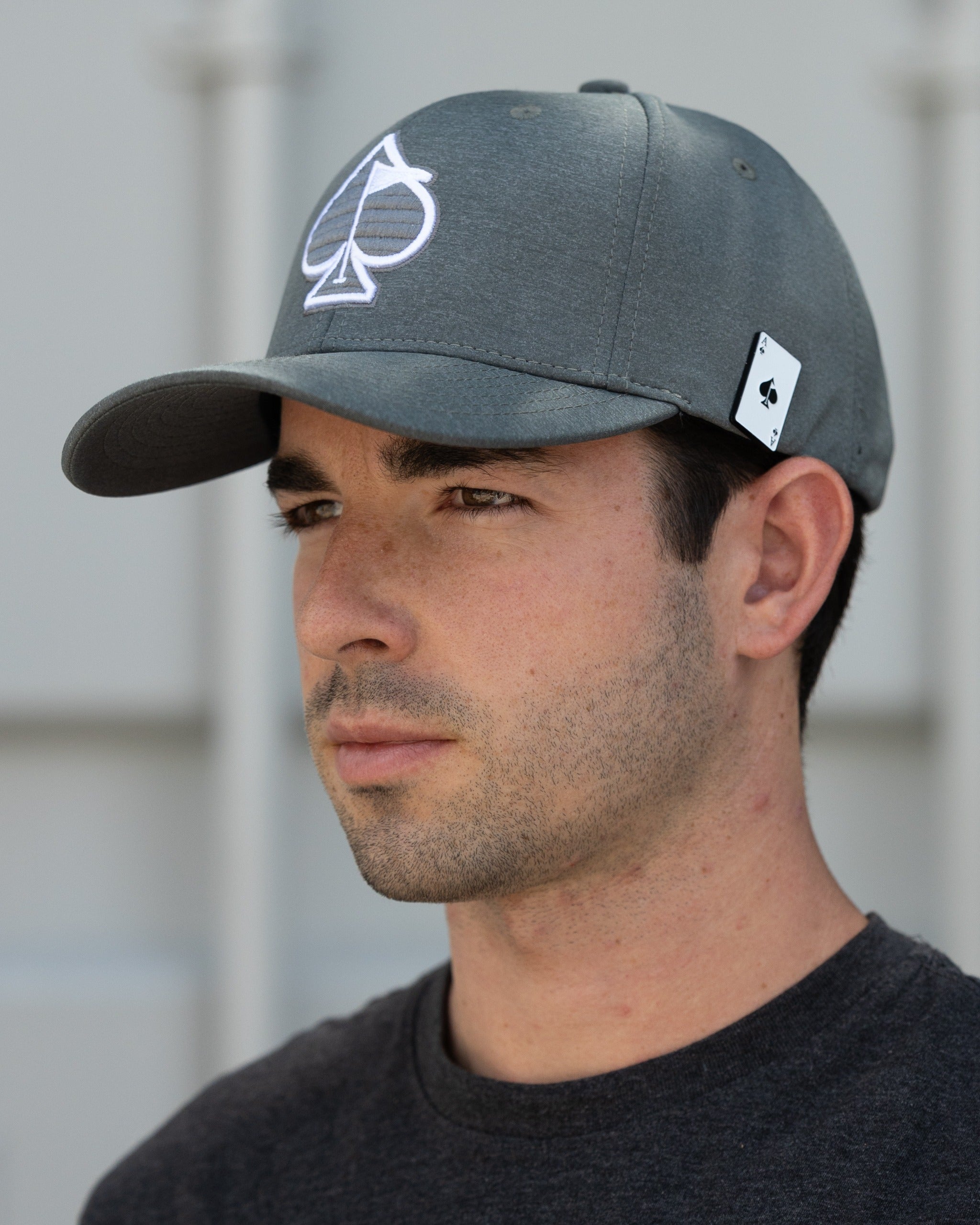 Ash performance spade hat featuring a white spade logo, designed for golfers seeking stylish and functional headwear.