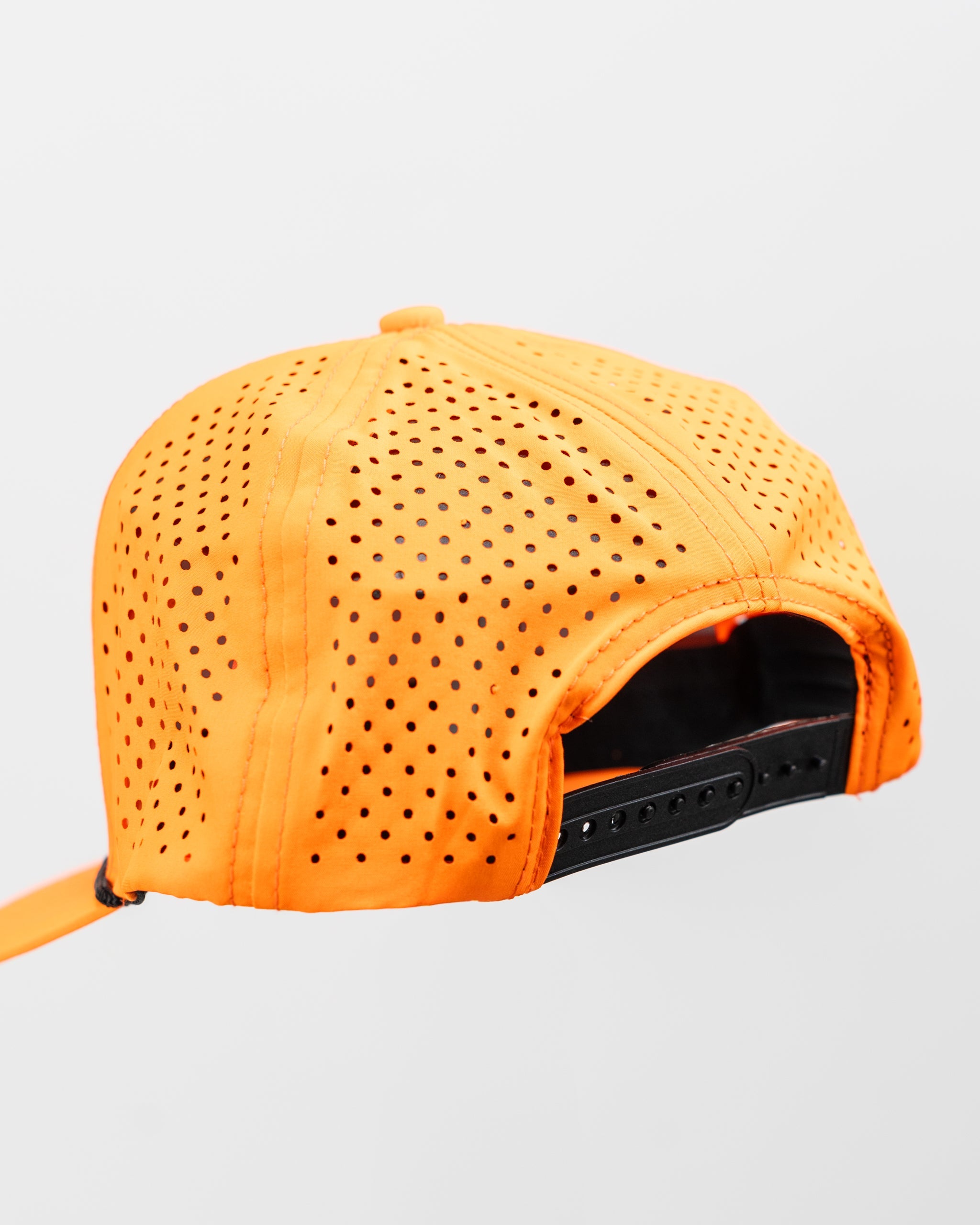 Perforated highlighter orange rope hat with snapback closure.