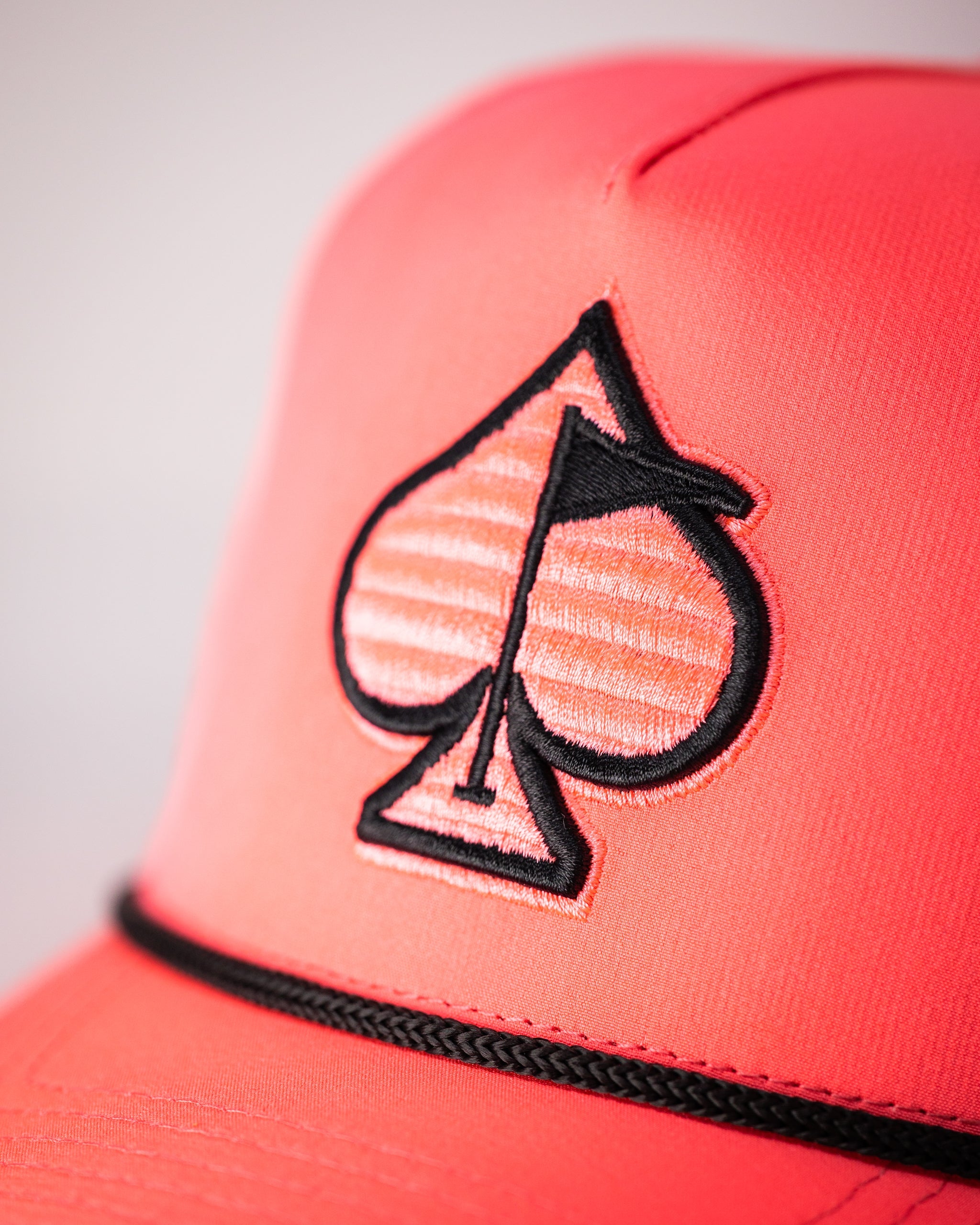 Perforated Rope Hat in Highlighter Pink with a stylish design and breathable material.