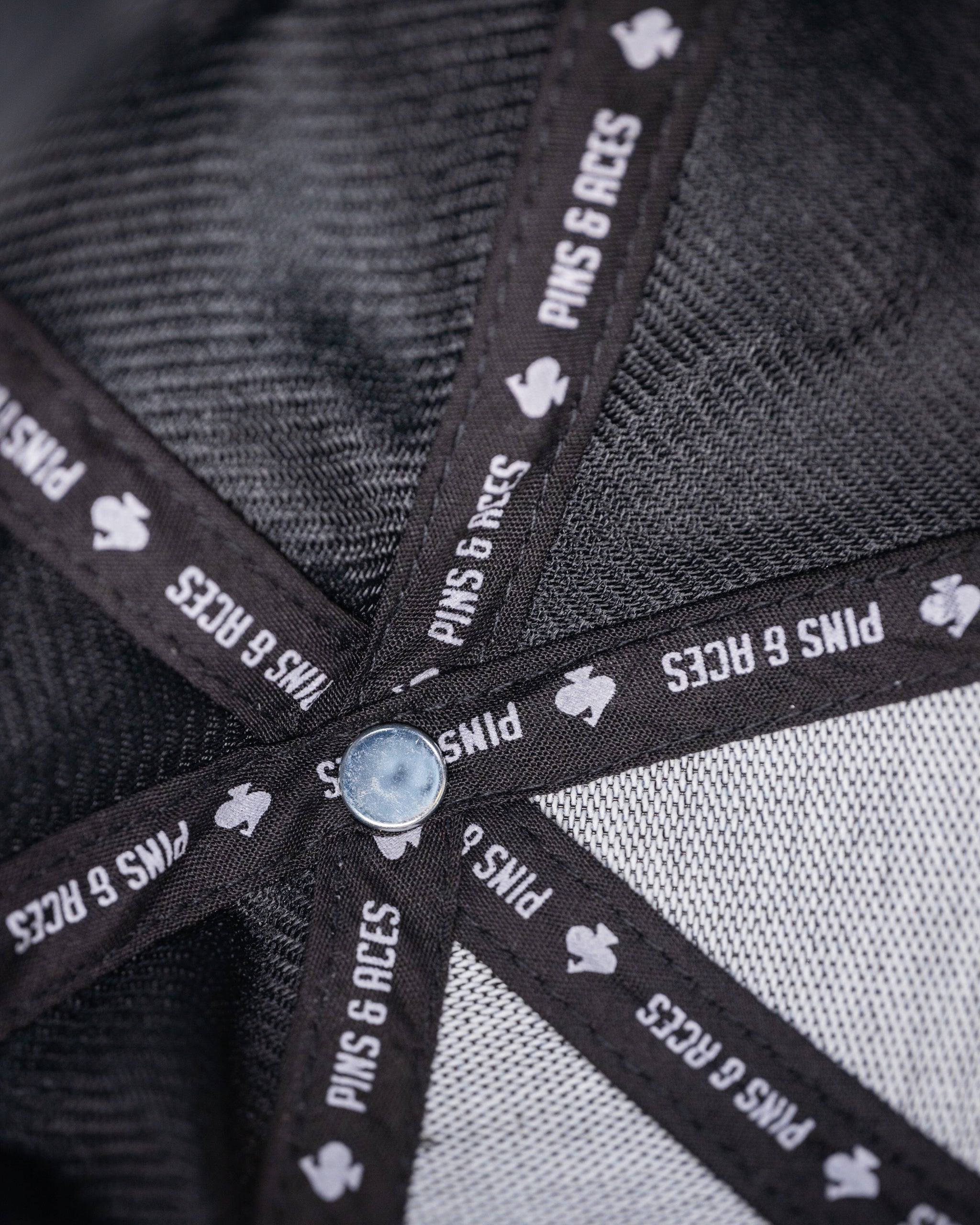 Performance Spade Hat in charcoal gray, featuring a sleek design and breathable fabric, ideal for outdoor activities.