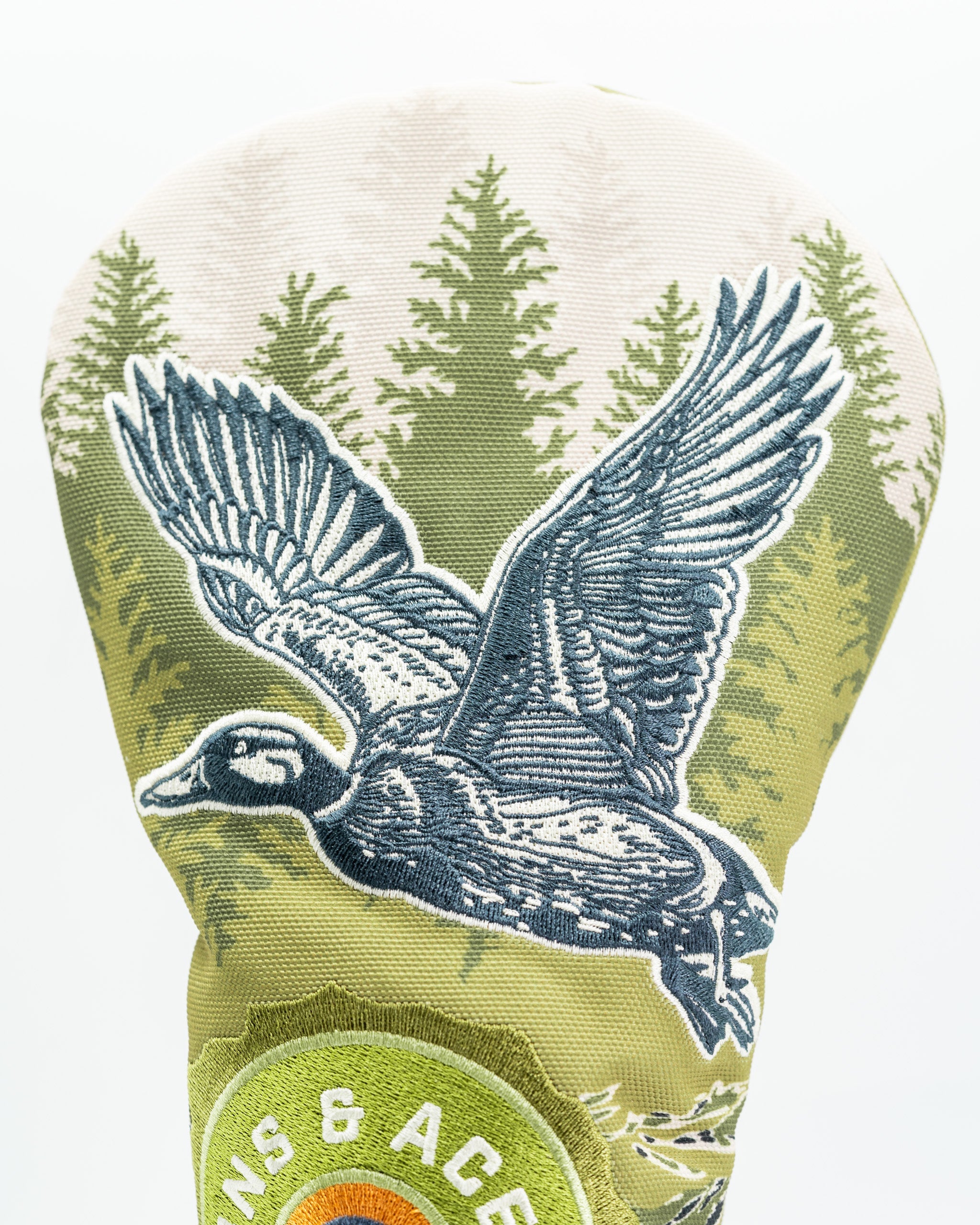Open Season Mallard driver cover featuring a detailed flying duck design against a forest backdrop, perfect for stylish golfers.