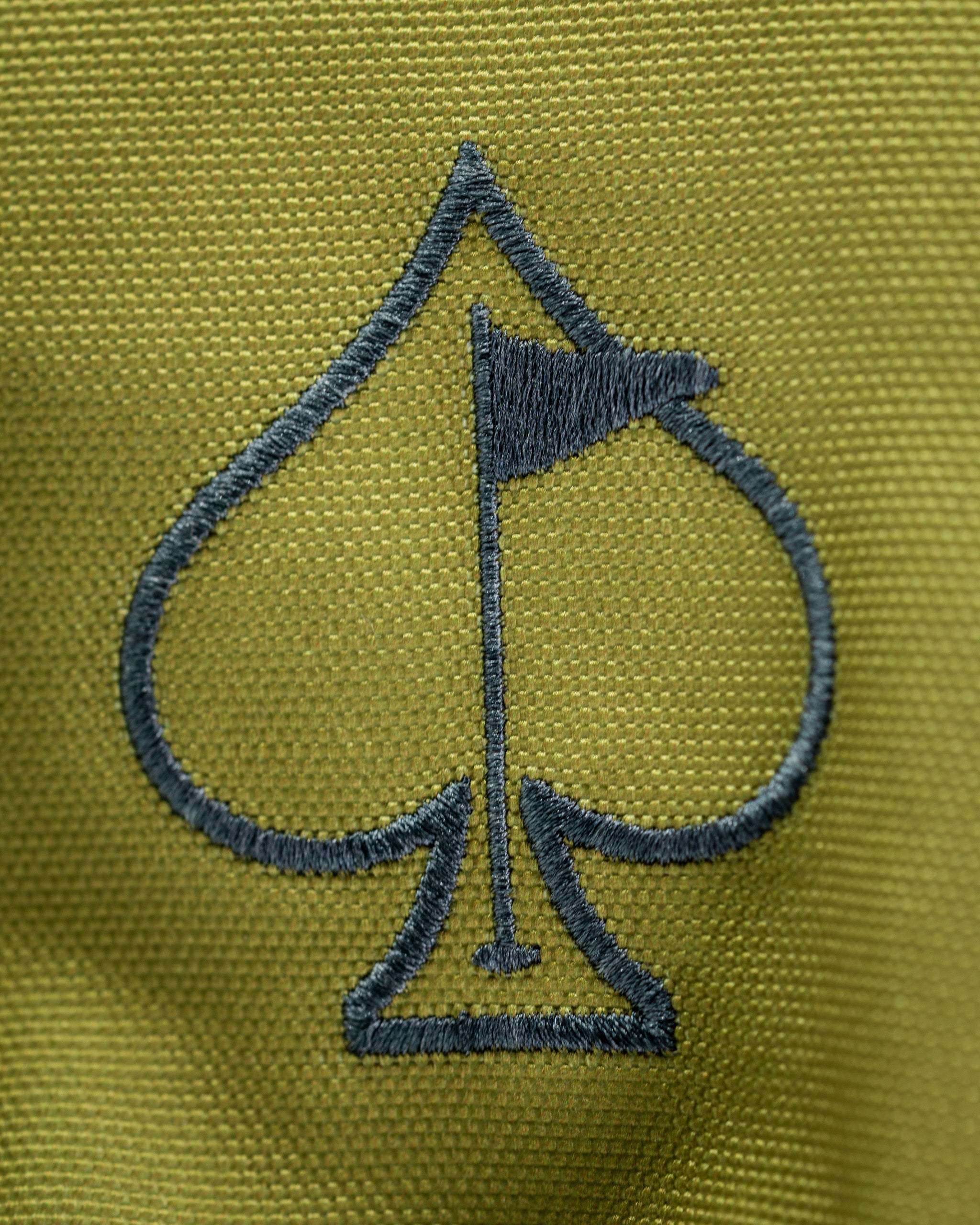 Open Season Mallard driver cover featuring a stylish spade logo with a golf flag on a green fabric background.