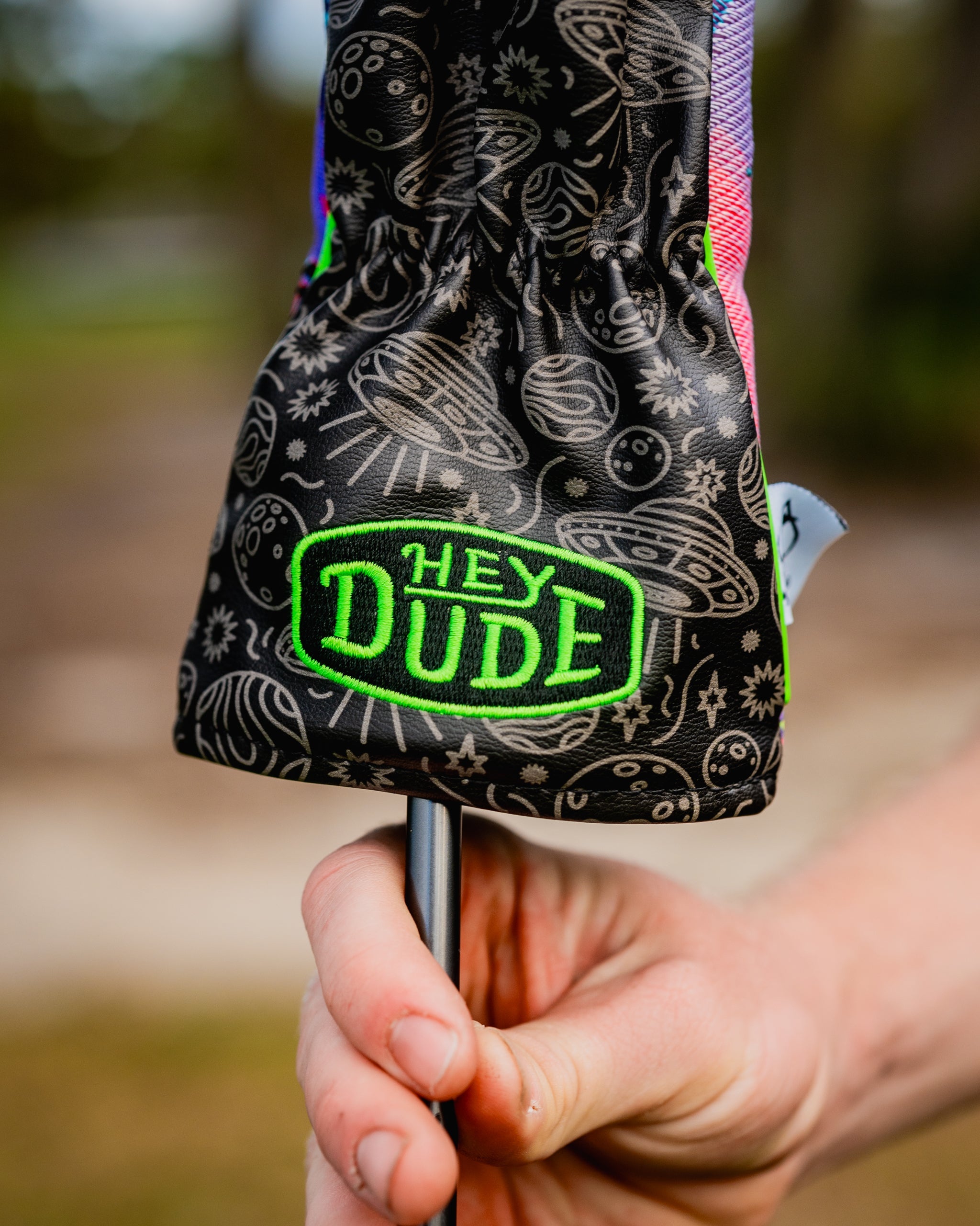 HEYDUDE Fairway Cover in blue and white plaid design, featuring a stylish golf-themed graphic, ideal for added protection and a trendy look on the golf course.