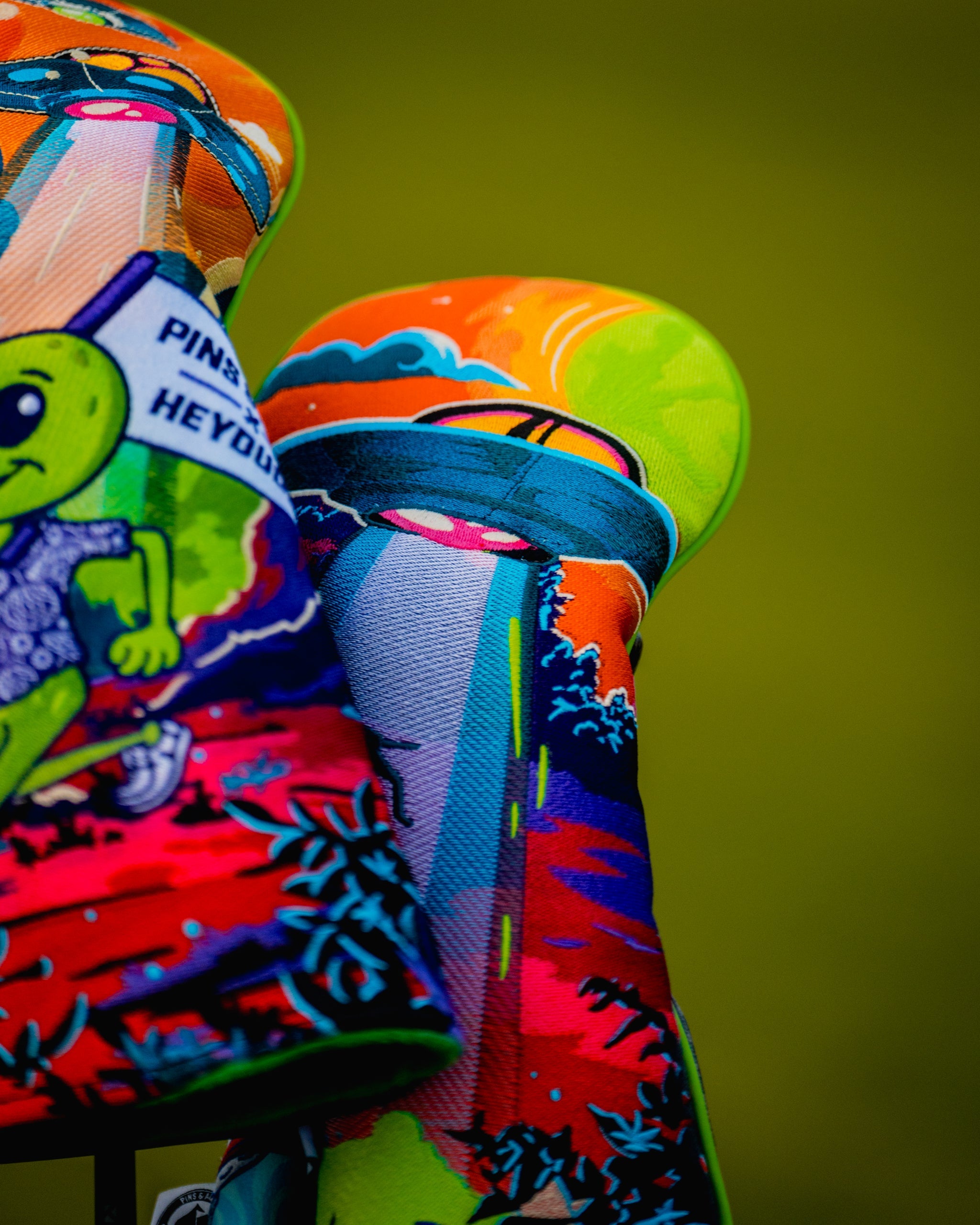 Alt text: "HEYDUDE Fairway Cover in vibrant colors, showcasing ergonomic design and stylish pattern, ideal for outdoor activities."