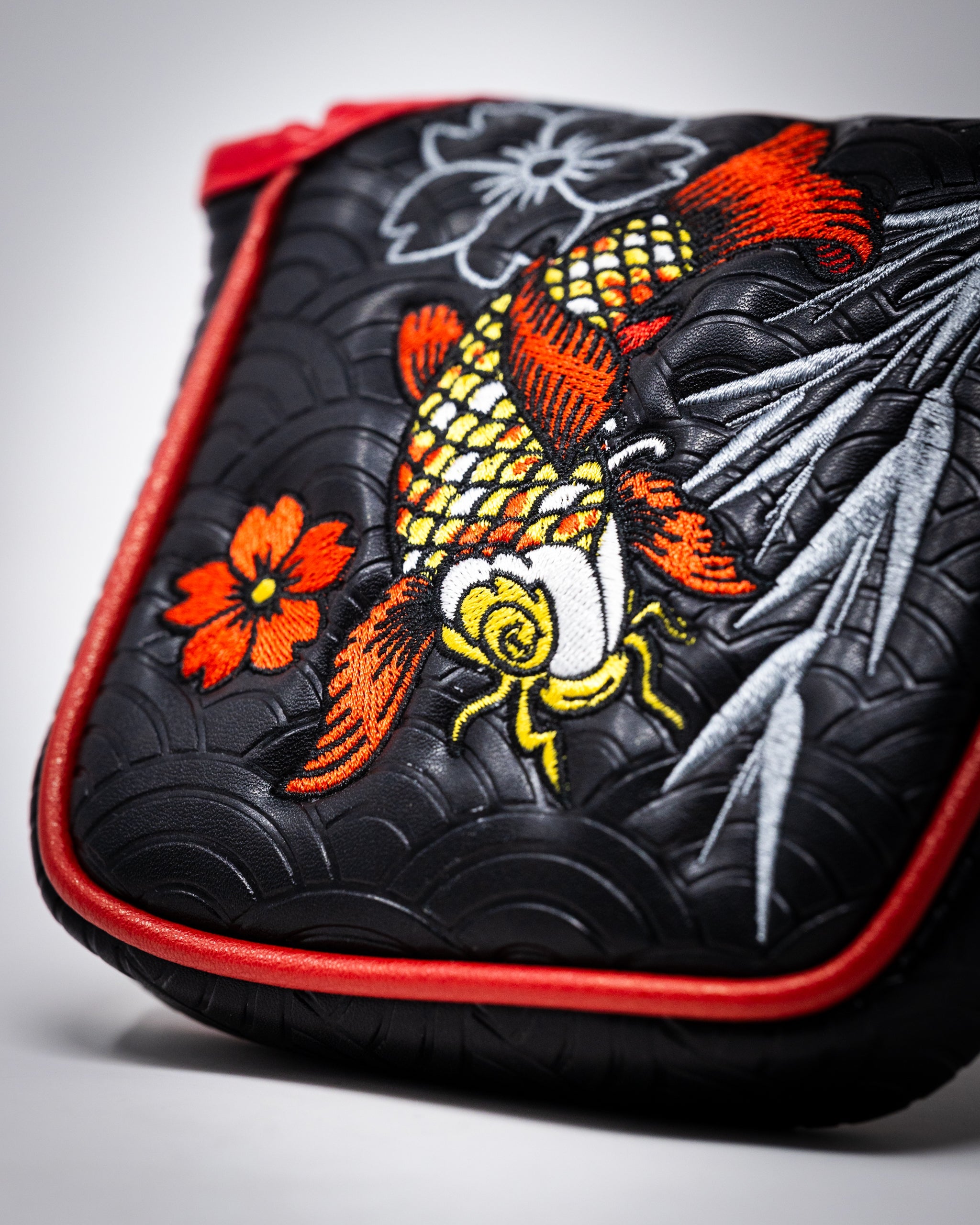 Koi Flow mallet putter cover featuring an artistic koi fish design on a dark background.