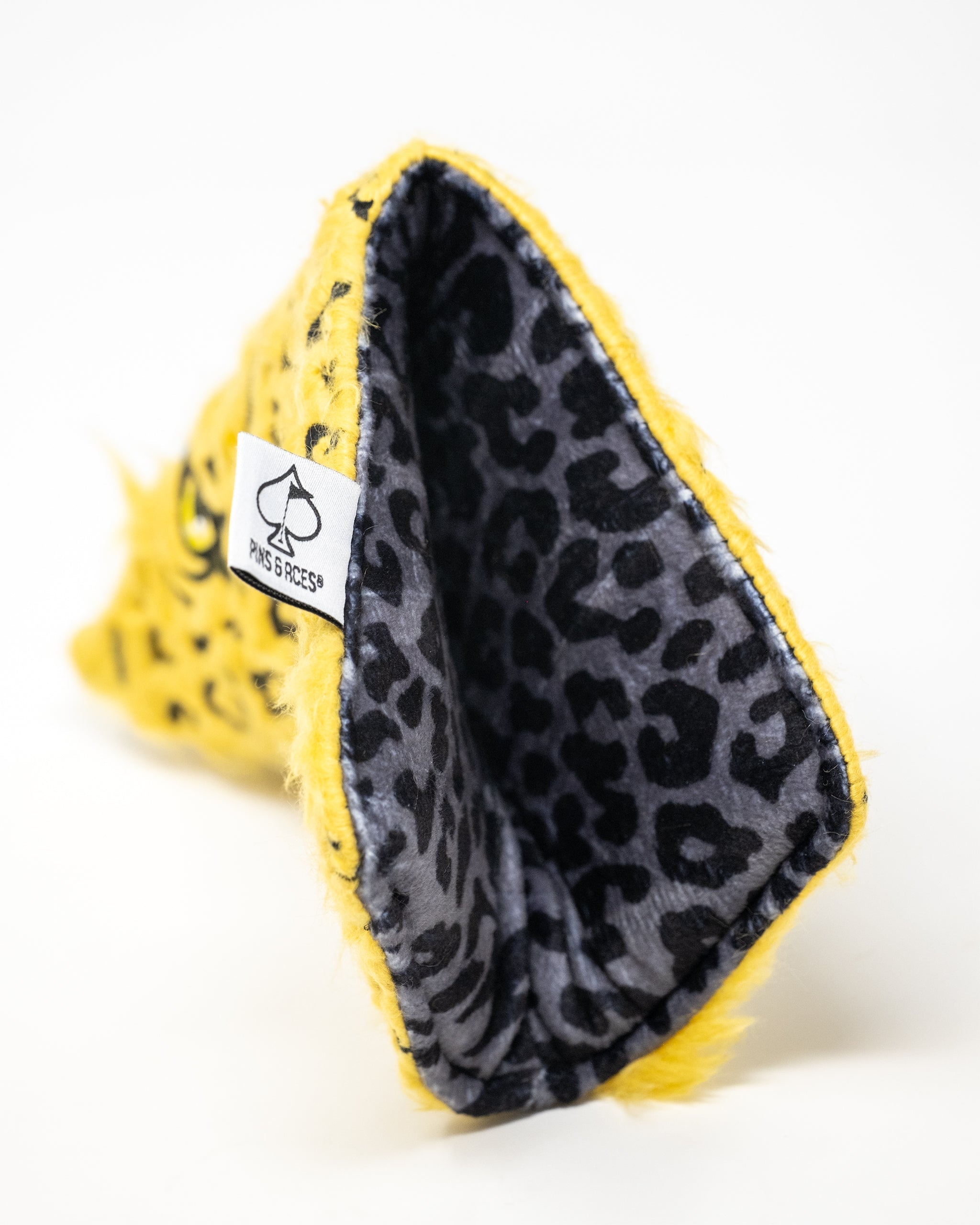 Leopard print blade putter cover with a sleek design and padded protection for golf clubs.