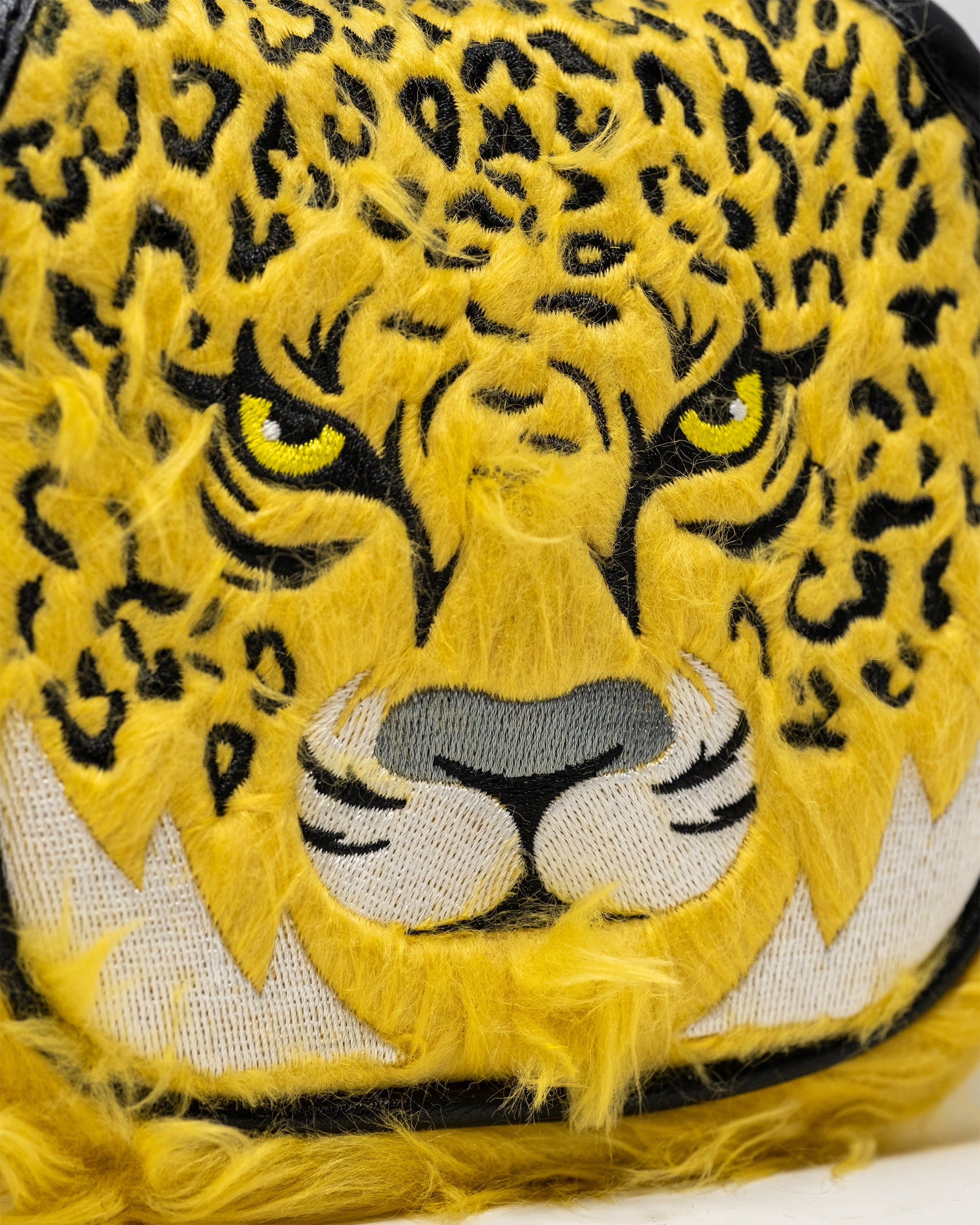 Leopard print mallet putter cover designed for golf clubs, featuring vibrant colors and a protective fit.