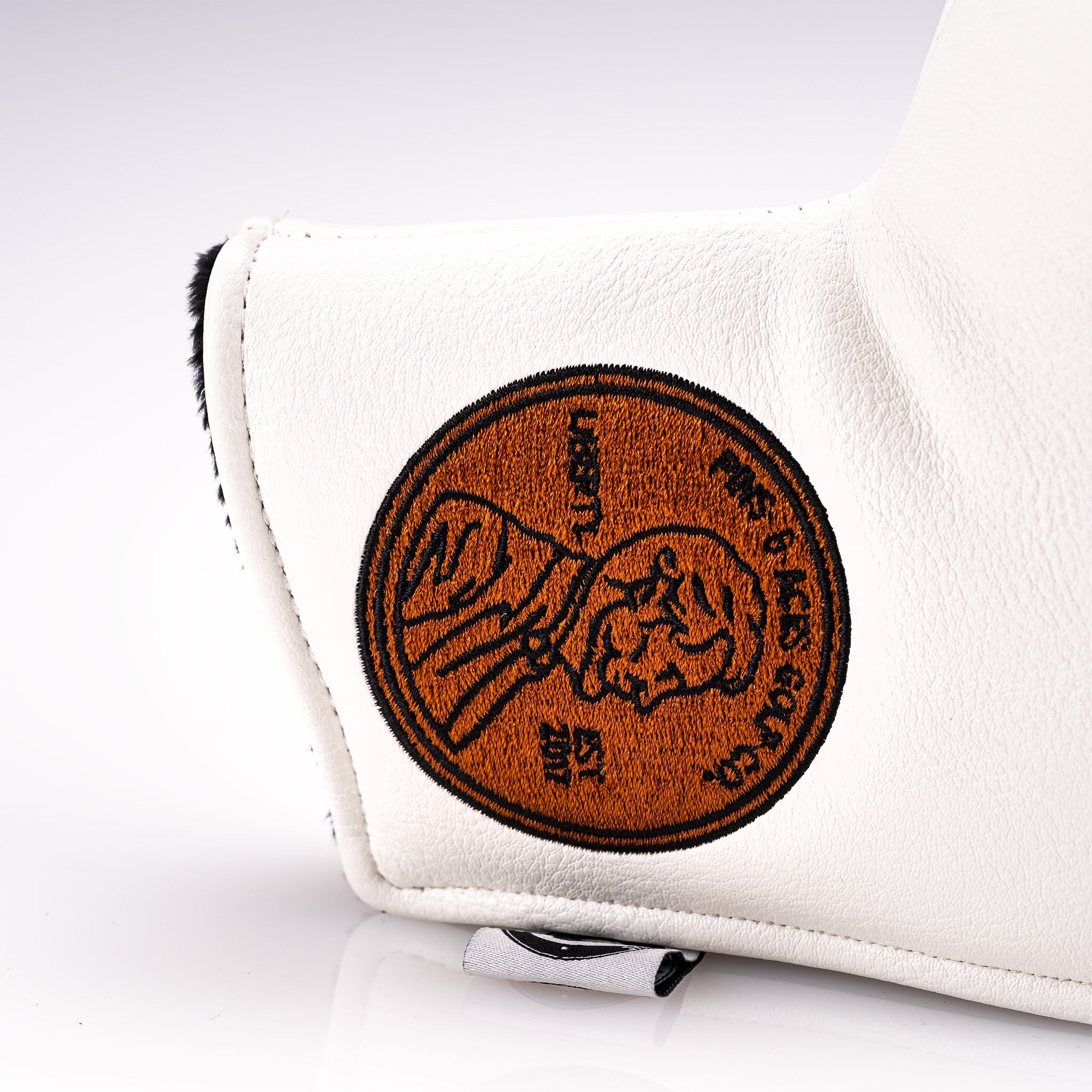 Lincoln blade putter cover featuring a classic penny design with intricate detailing and a sleek finish.