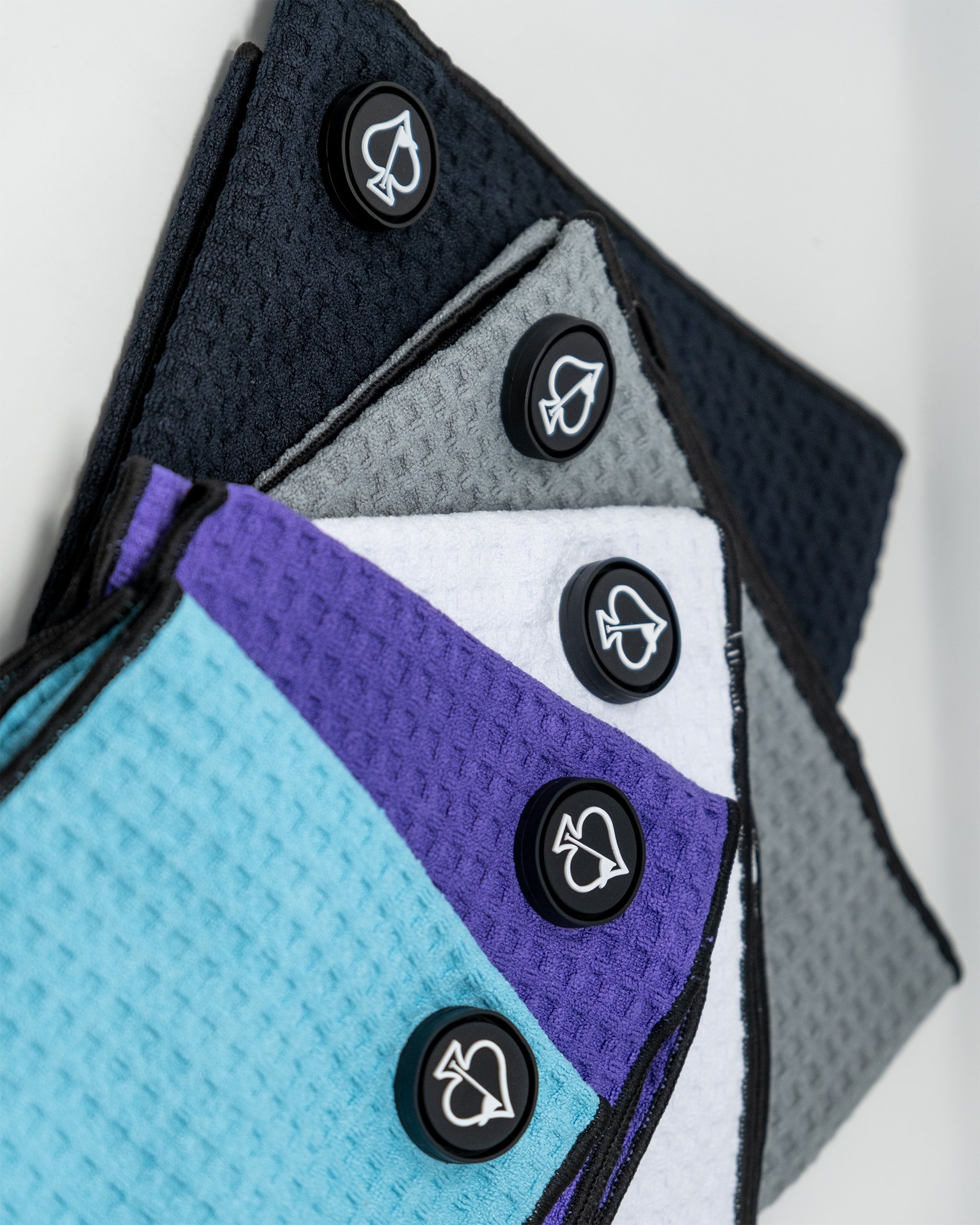 Magnetic towel in a grape color with a subtle texture, showcasing its magnetic attachment feature.