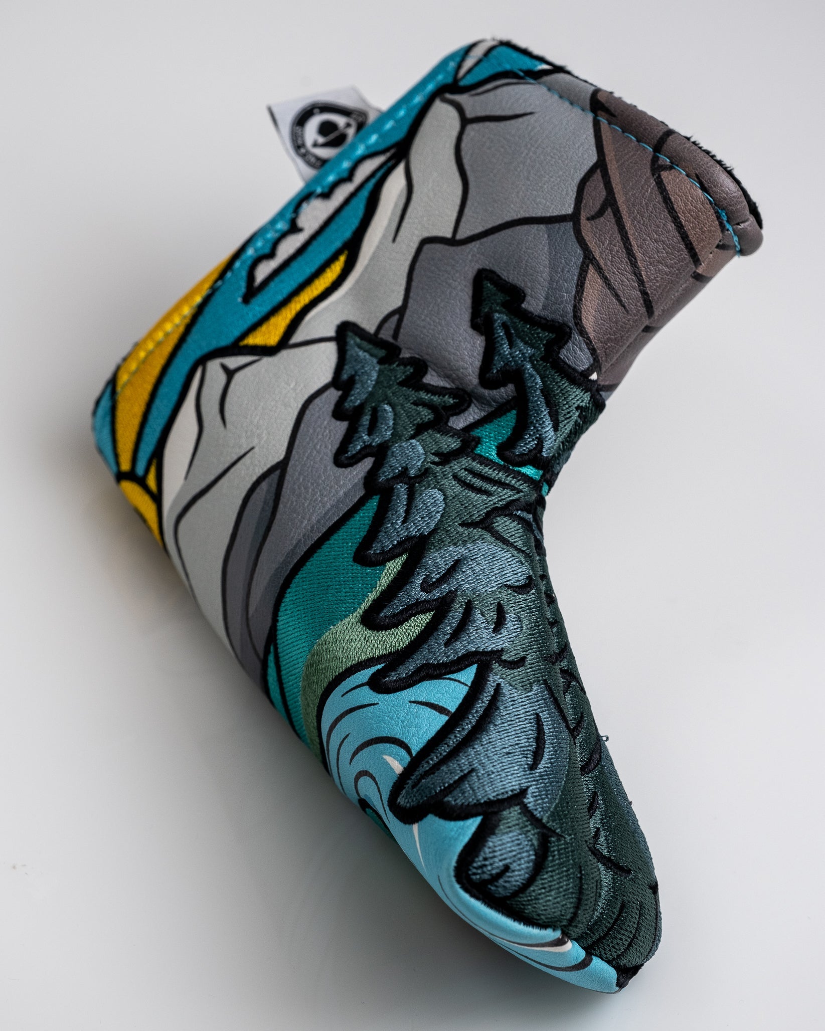 Colorful embroidered golf headcover featuring mountain and forest design, ideal for bold, unique golf accessories.