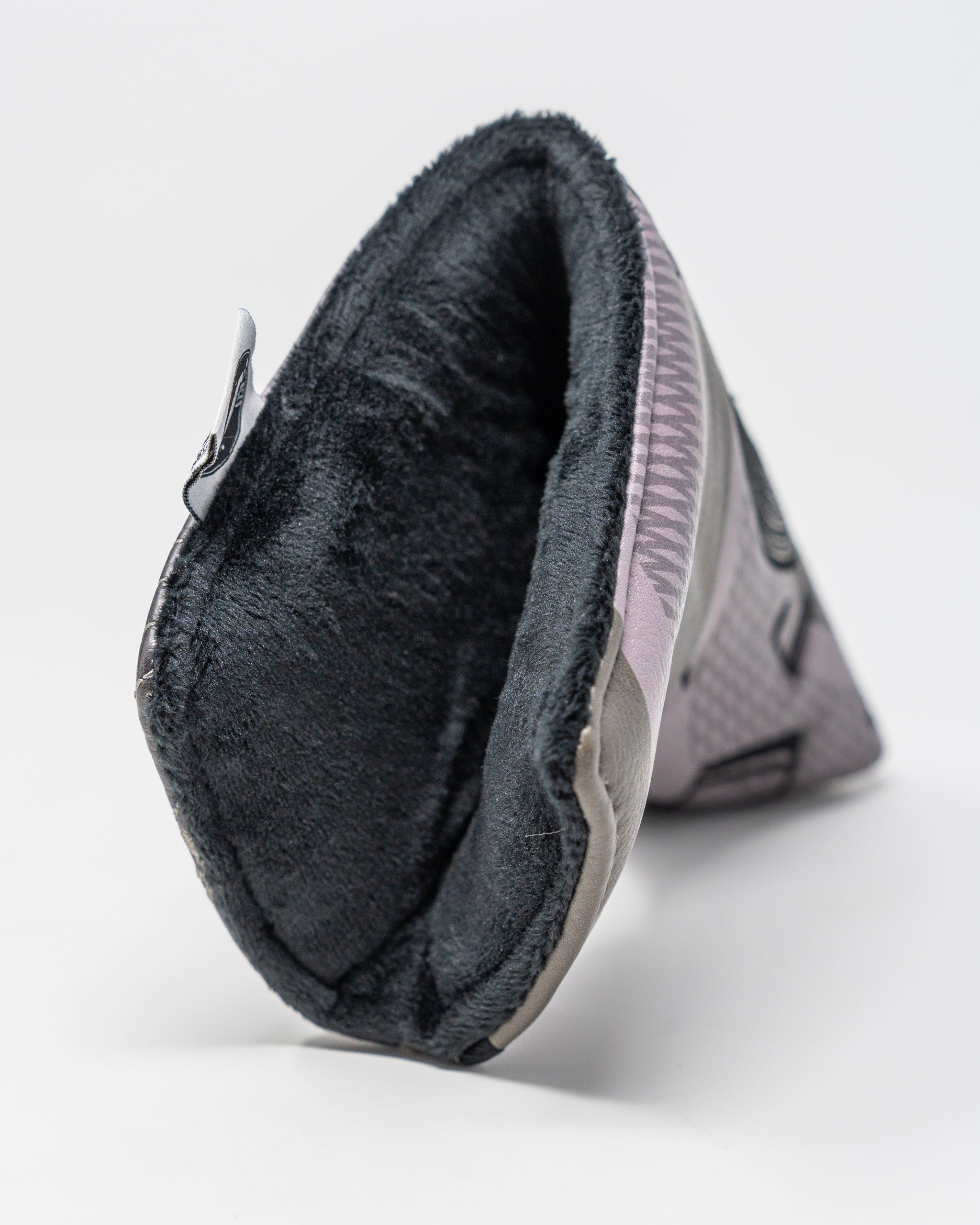 Music City blade putter cover with a vibrant design featuring musical notes and cityscape elements.