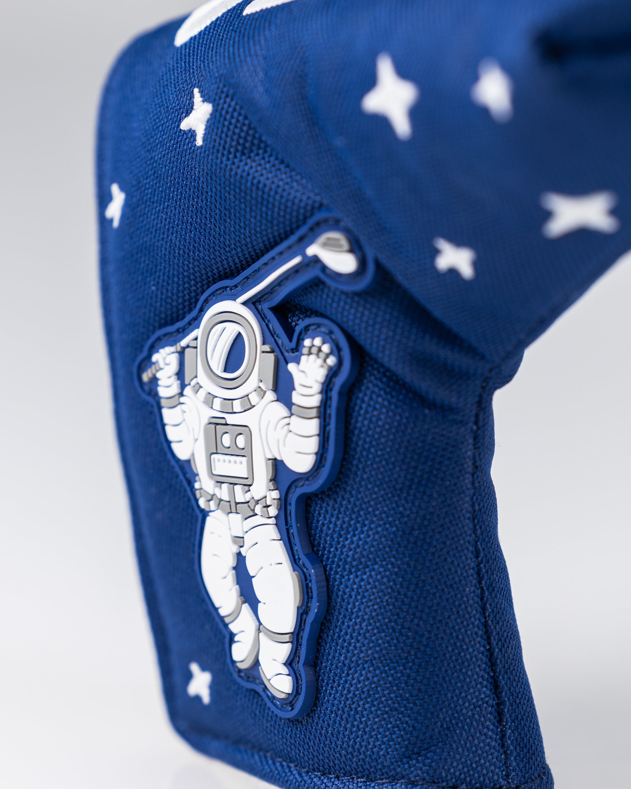 NASA Space Walk Blade Putter Cover featuring a vibrant space-themed design and embroidered NASA logo.