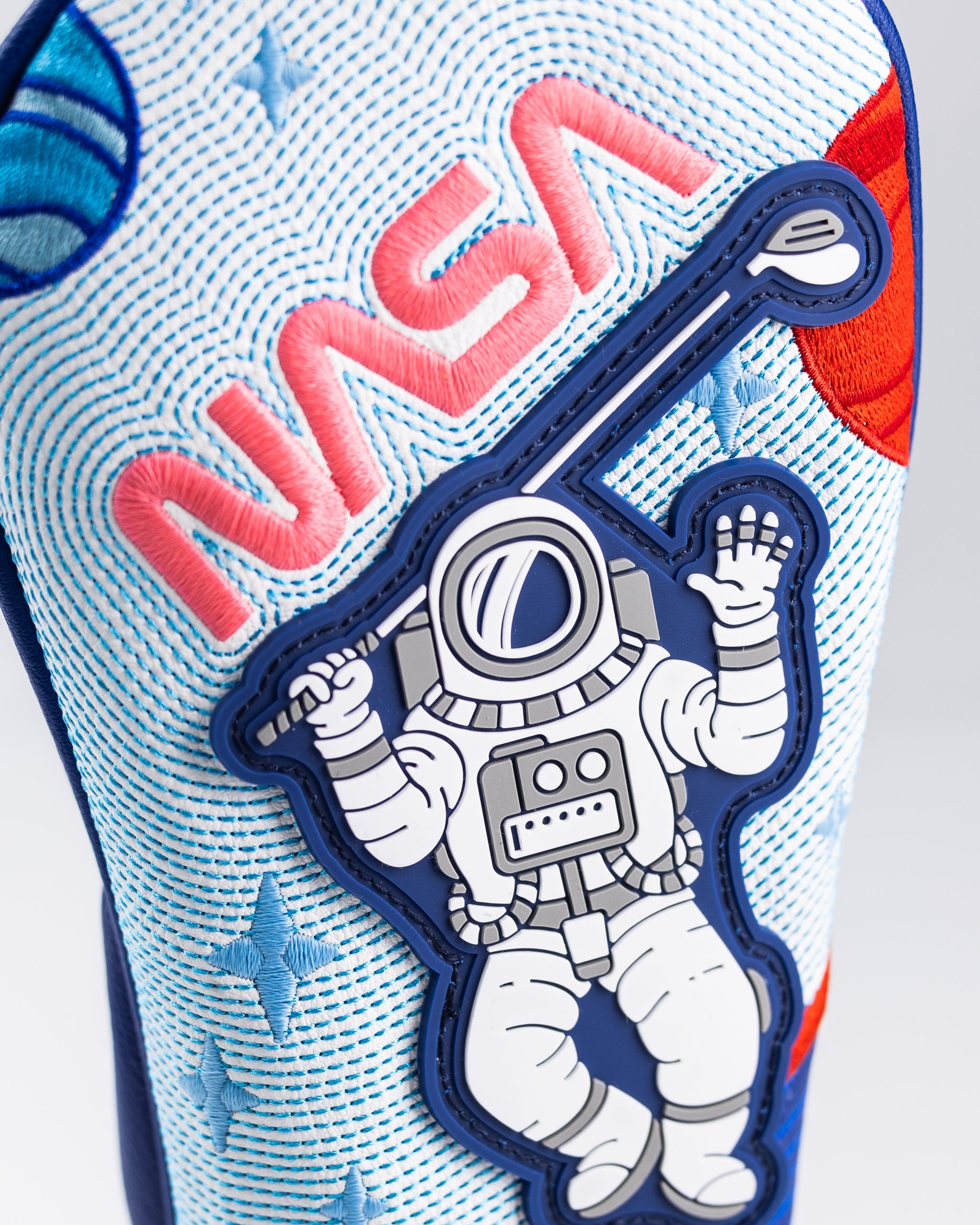 NASA Space Walk Fairway Cover featuring a vibrant design inspired by space exploration, perfect for golf enthusiasts.