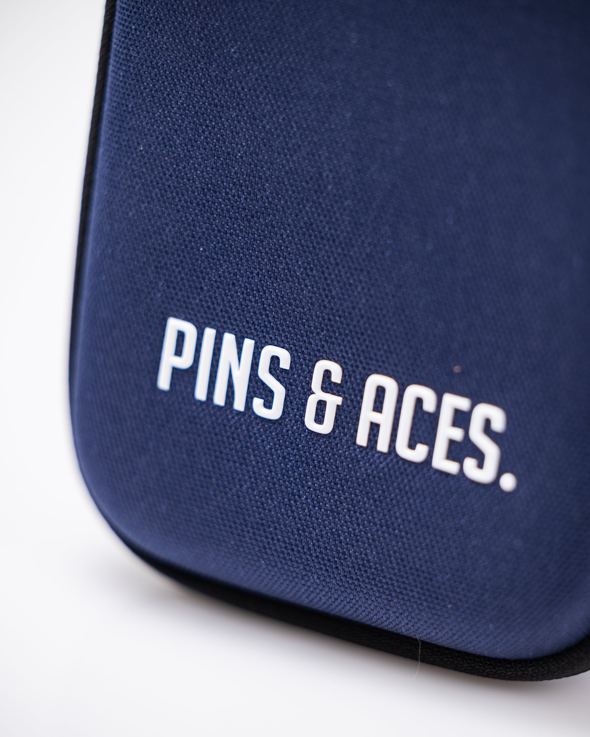 Navy glove and accessory caddie with multiple compartments for organized storage.