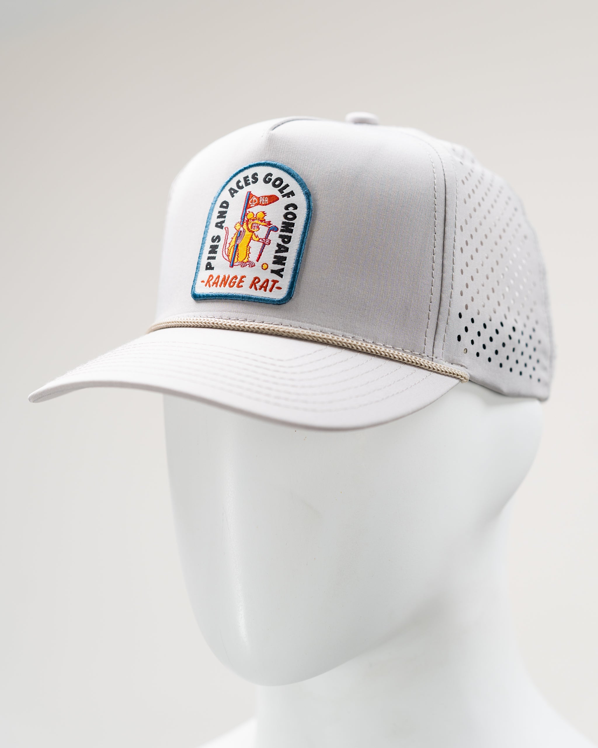 Perforated rope hat in bone color, featuring the Range Rat logo and stylish design.