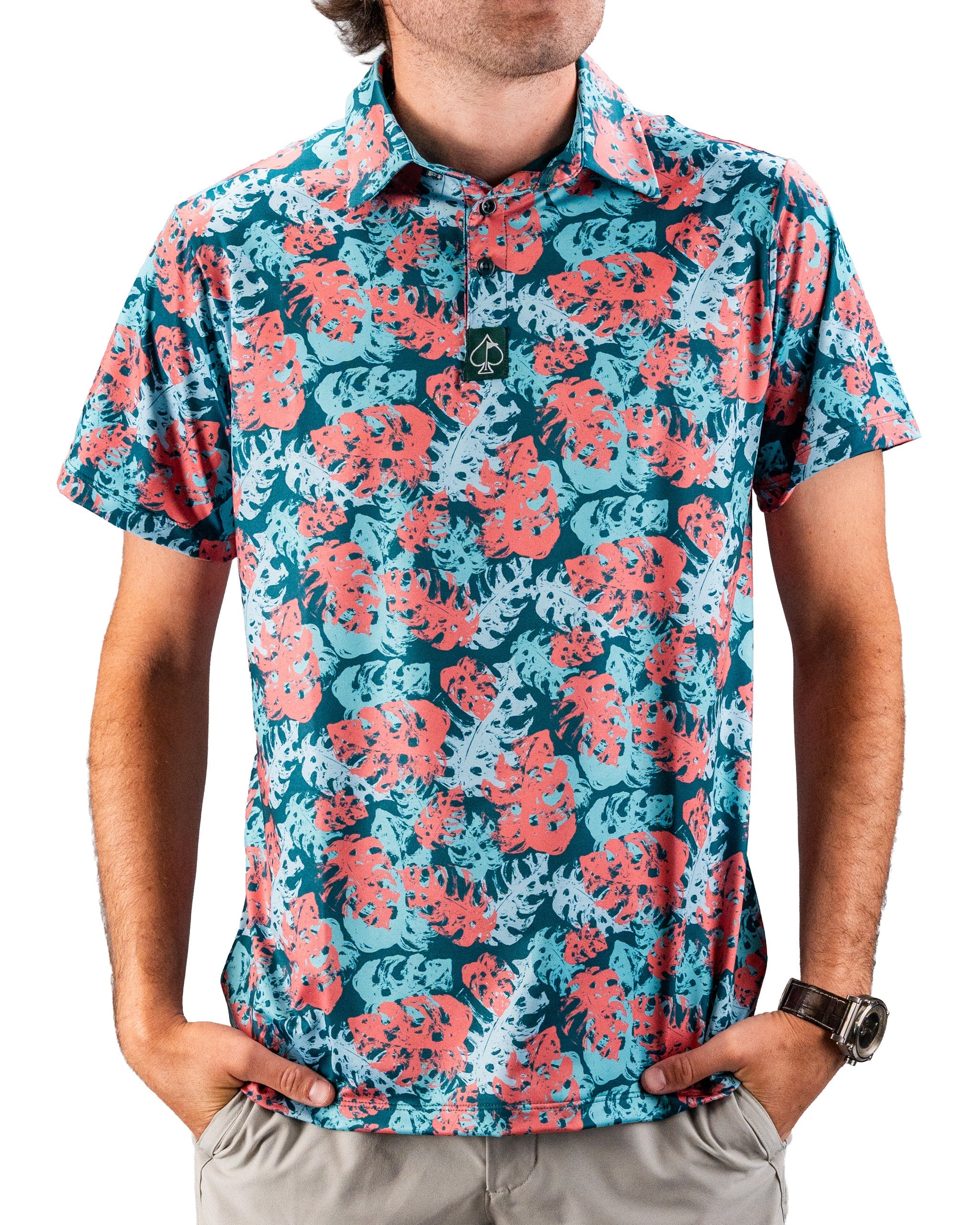 Bright tropical print golf shirt with blue, coral, and white leaves, short sleeves, and a collar. Perfect for bold course ...