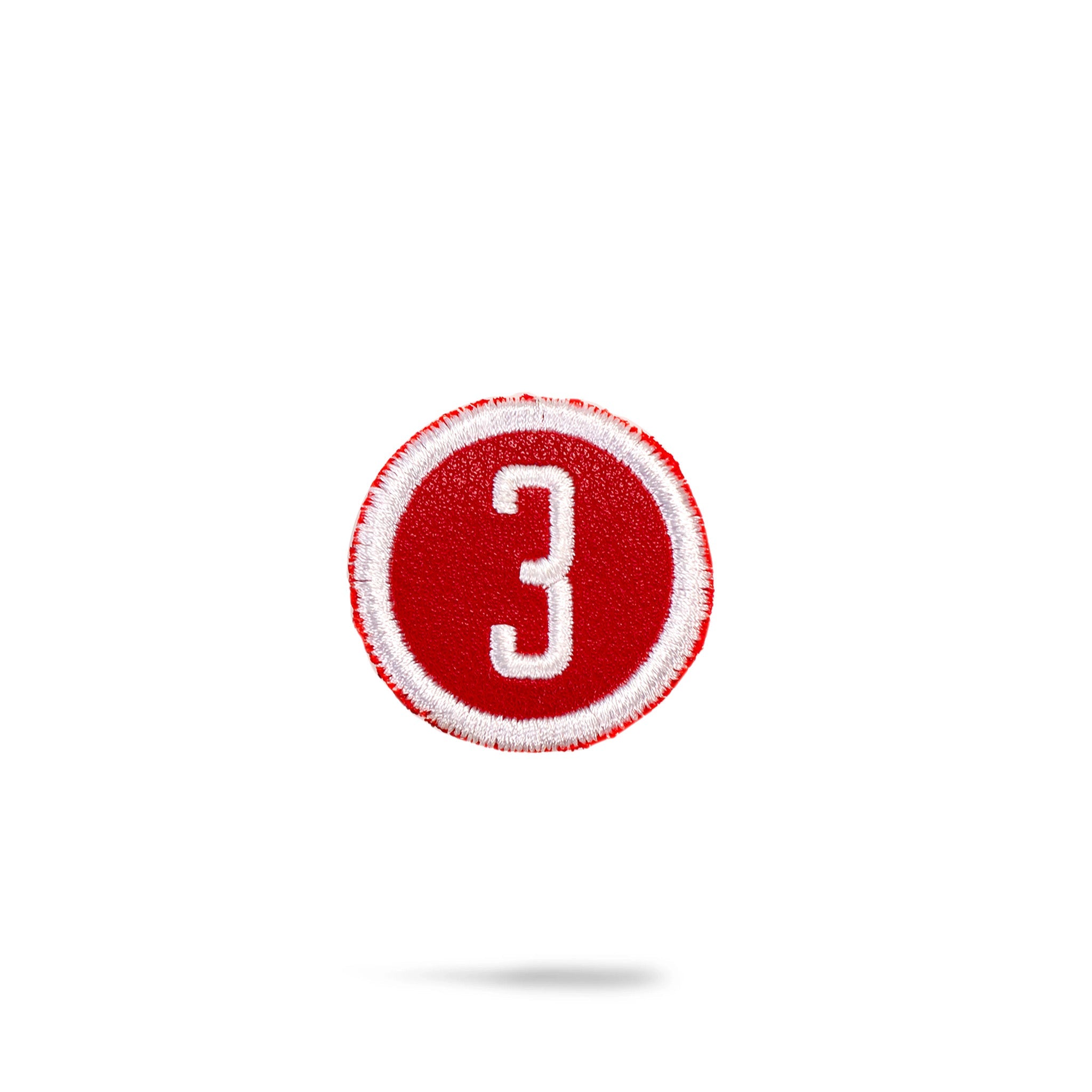 Red headcover patch featuring a sleek design, suitable for golf accessories.