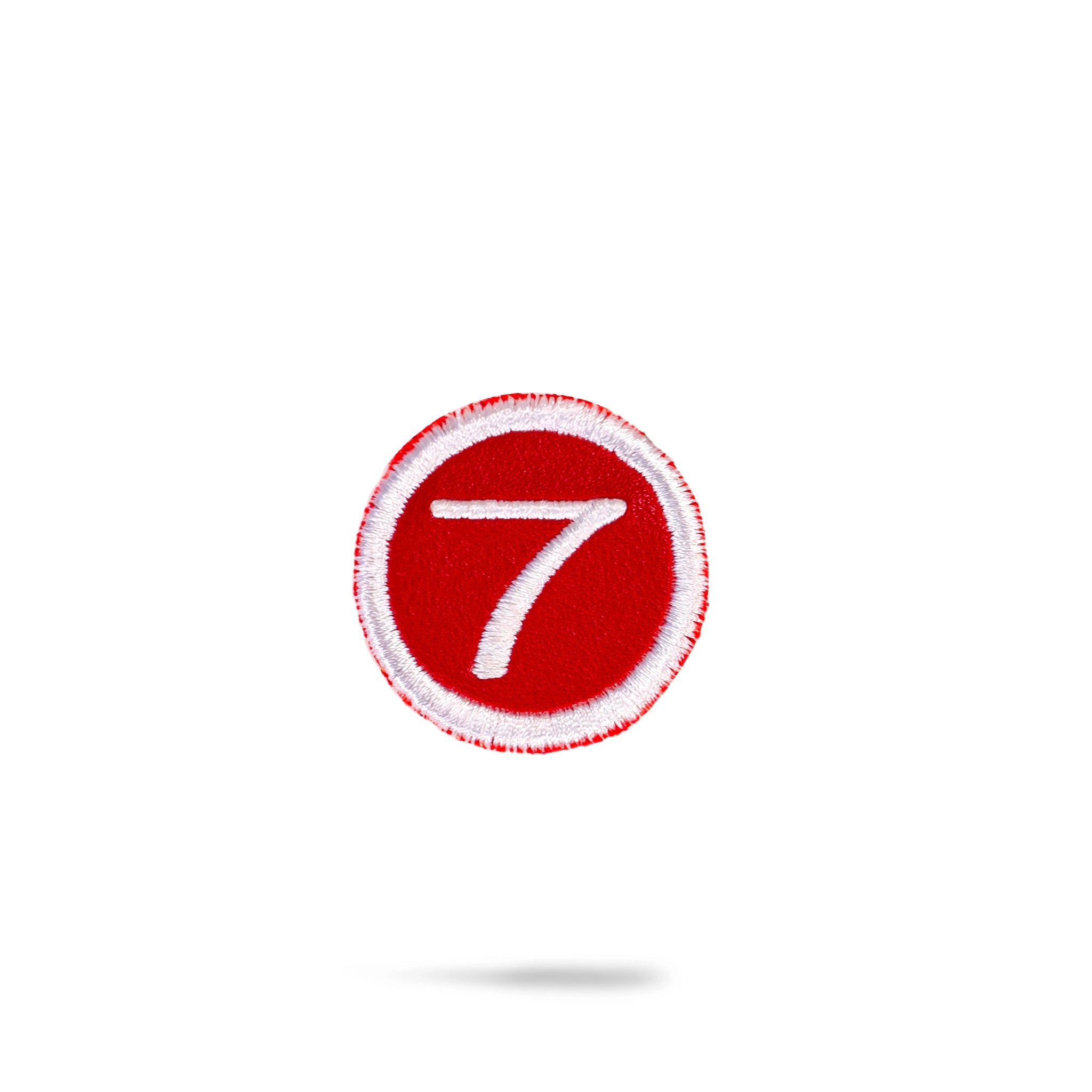 Red headcover patch featuring a sleek design, ideal for adorning golf clubs or bags.
