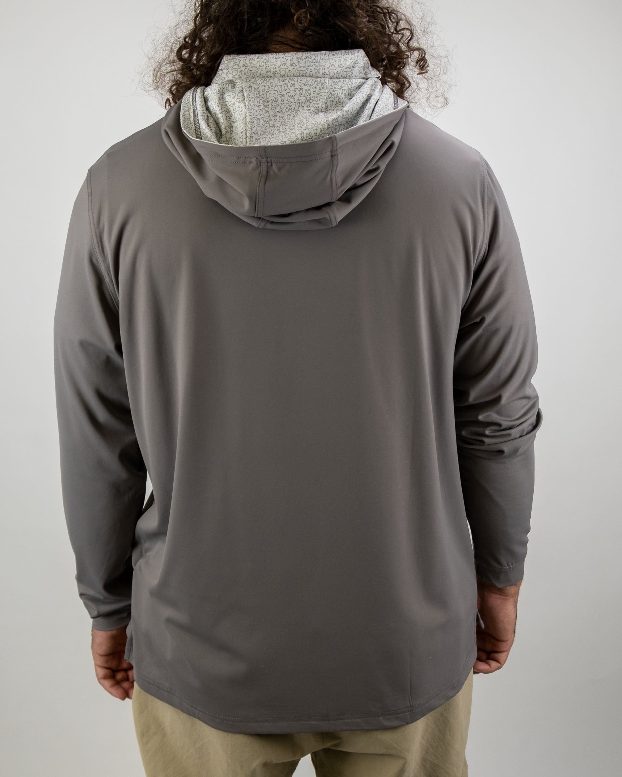 Men's performance golf hoodie in gray with a unique patterned hood, designed for comfort and style on the course.