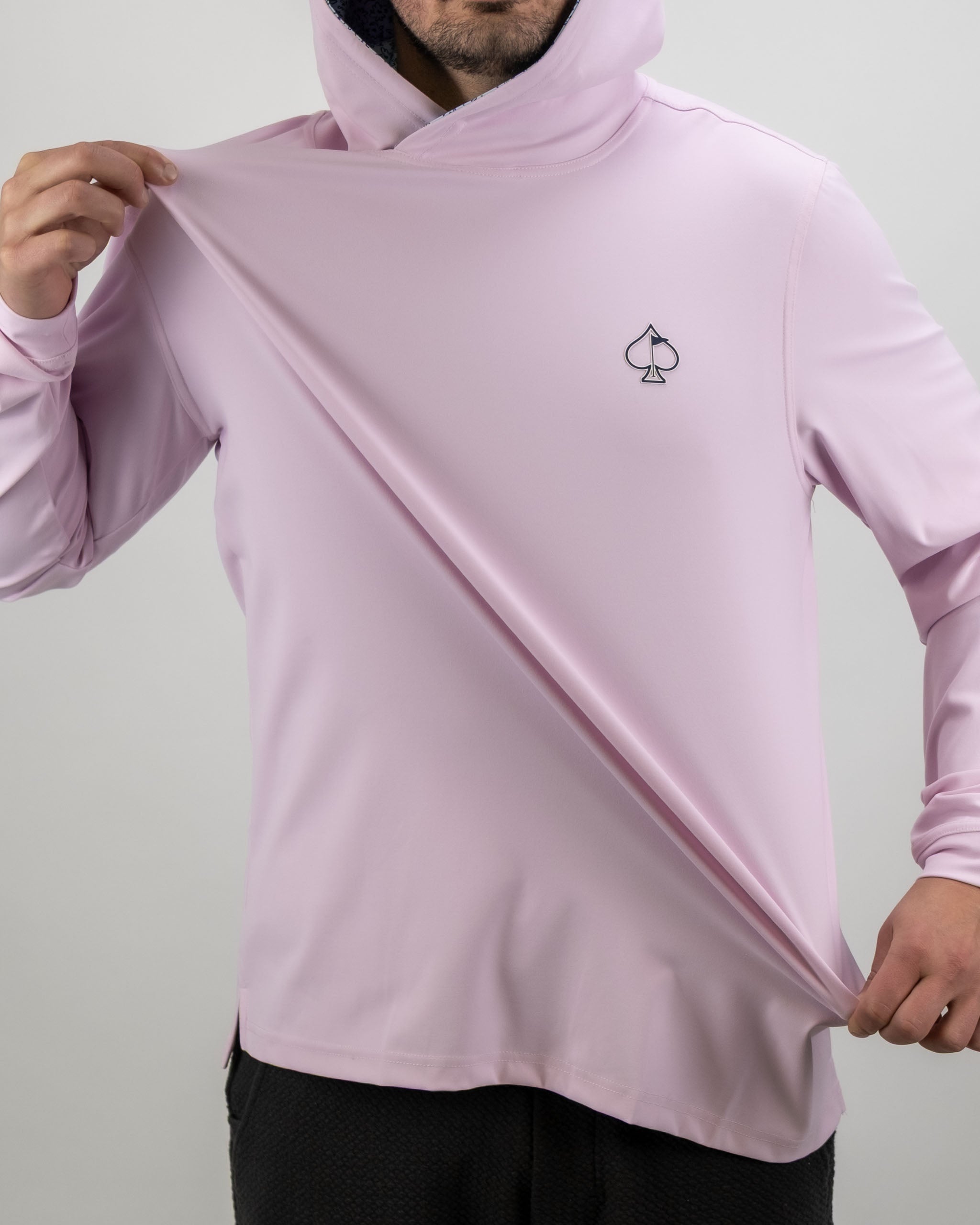 Men's performance golf hoodie in light blue with a flower doodle pattern, featuring a spade logo on the chest.
