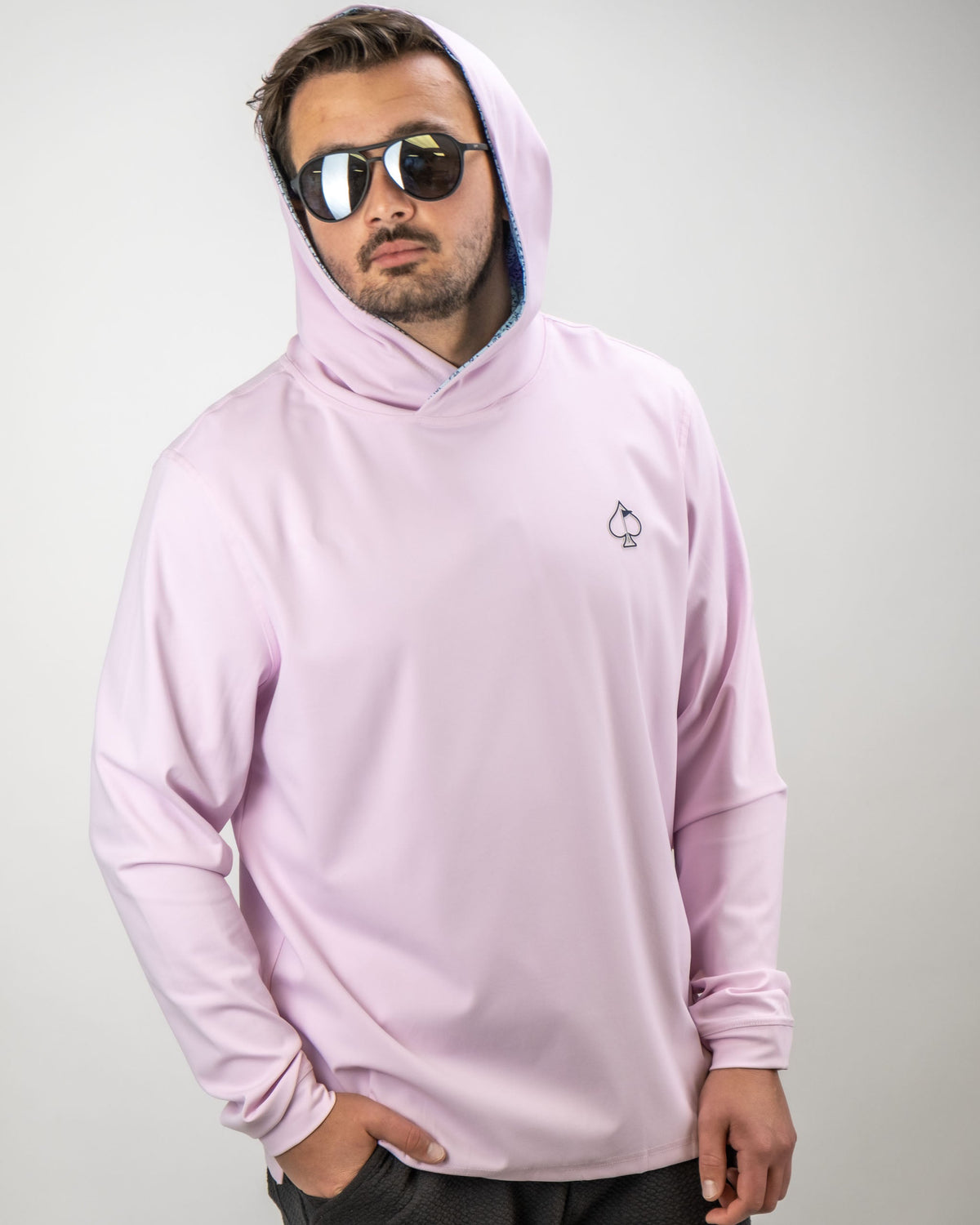 Men's performance golf hoodie in light blue with a flower doodle design, perfect for stylish comfort on the course.