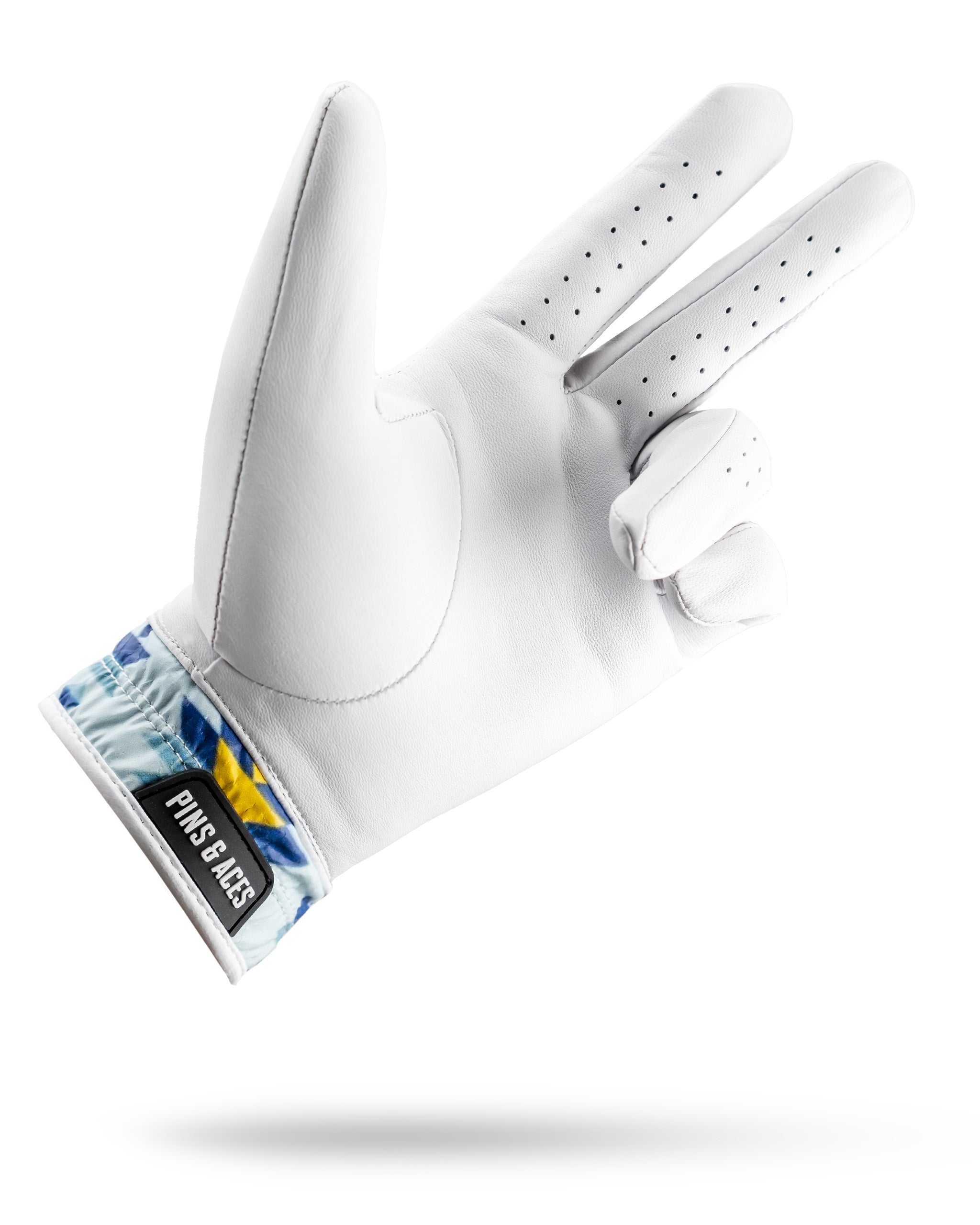 Premium Tour Glove in Southwest Sunset design featuring vibrant orange and purple hues, ideal for golfers seeking style and performance.