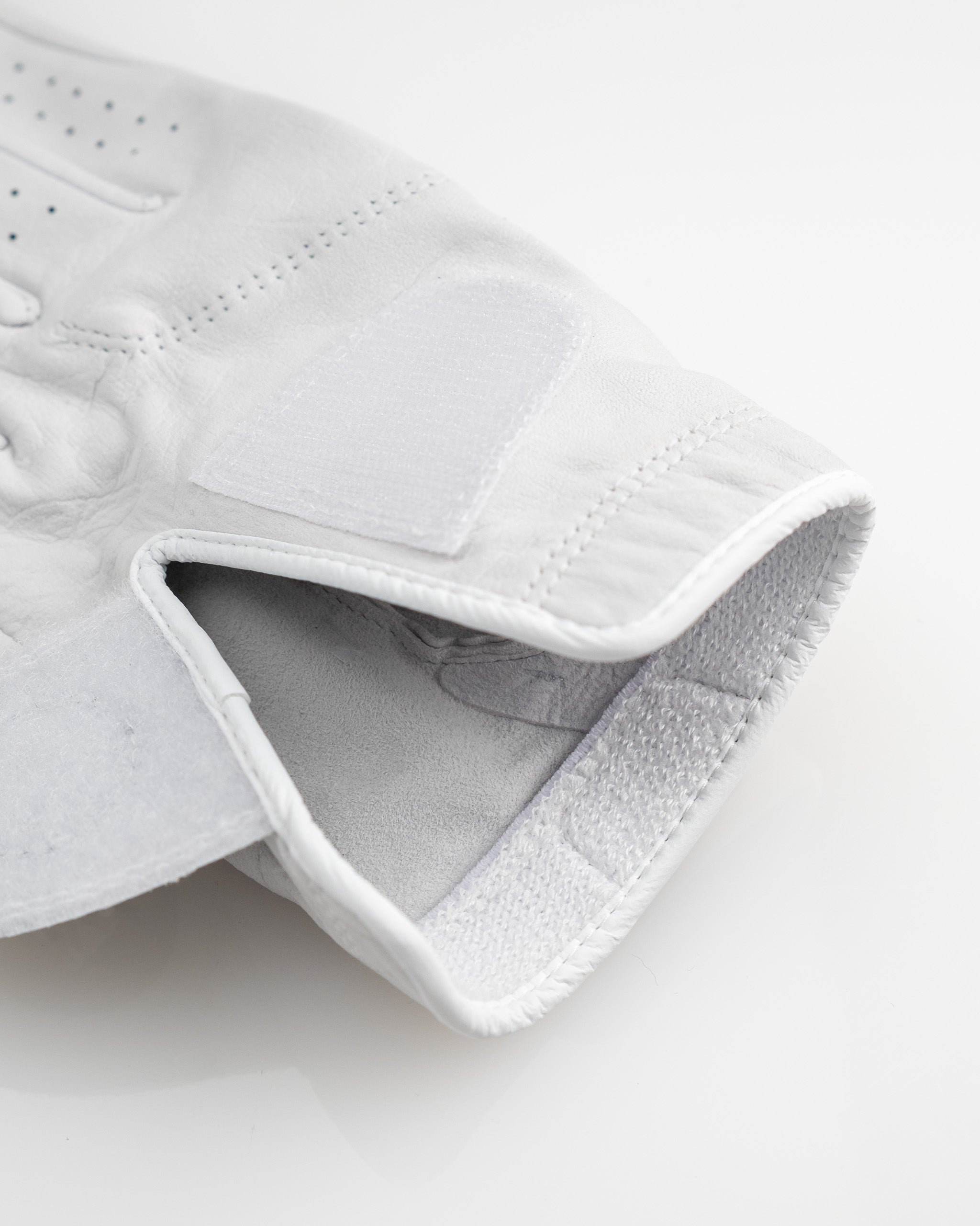 Premium Tour Glove in Ghost White, featuring a sleek design and moisture-wicking cuff.