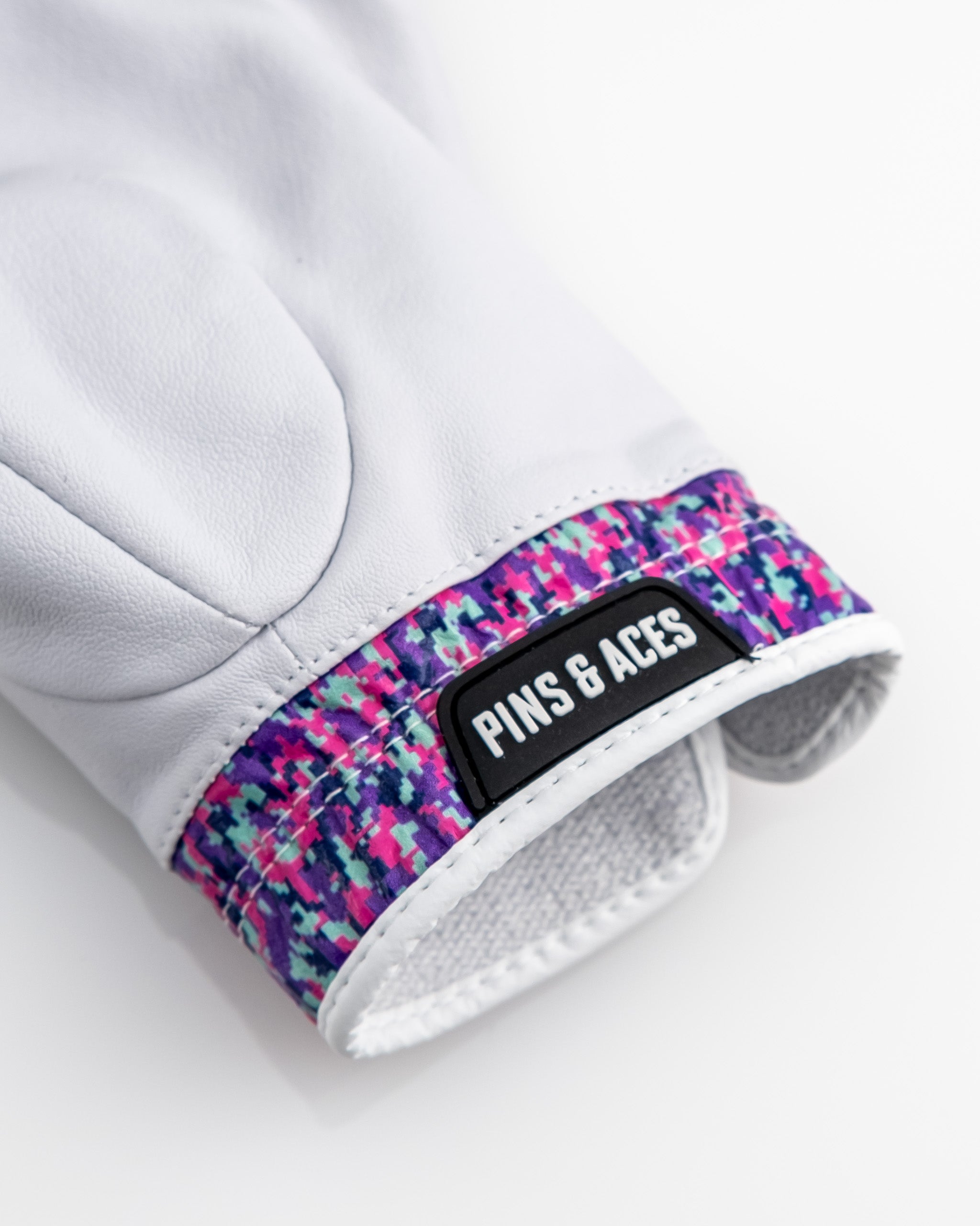 Premium Tour Glove in vivid camo design, showcasing a close-up of the fabric texture and detailing.