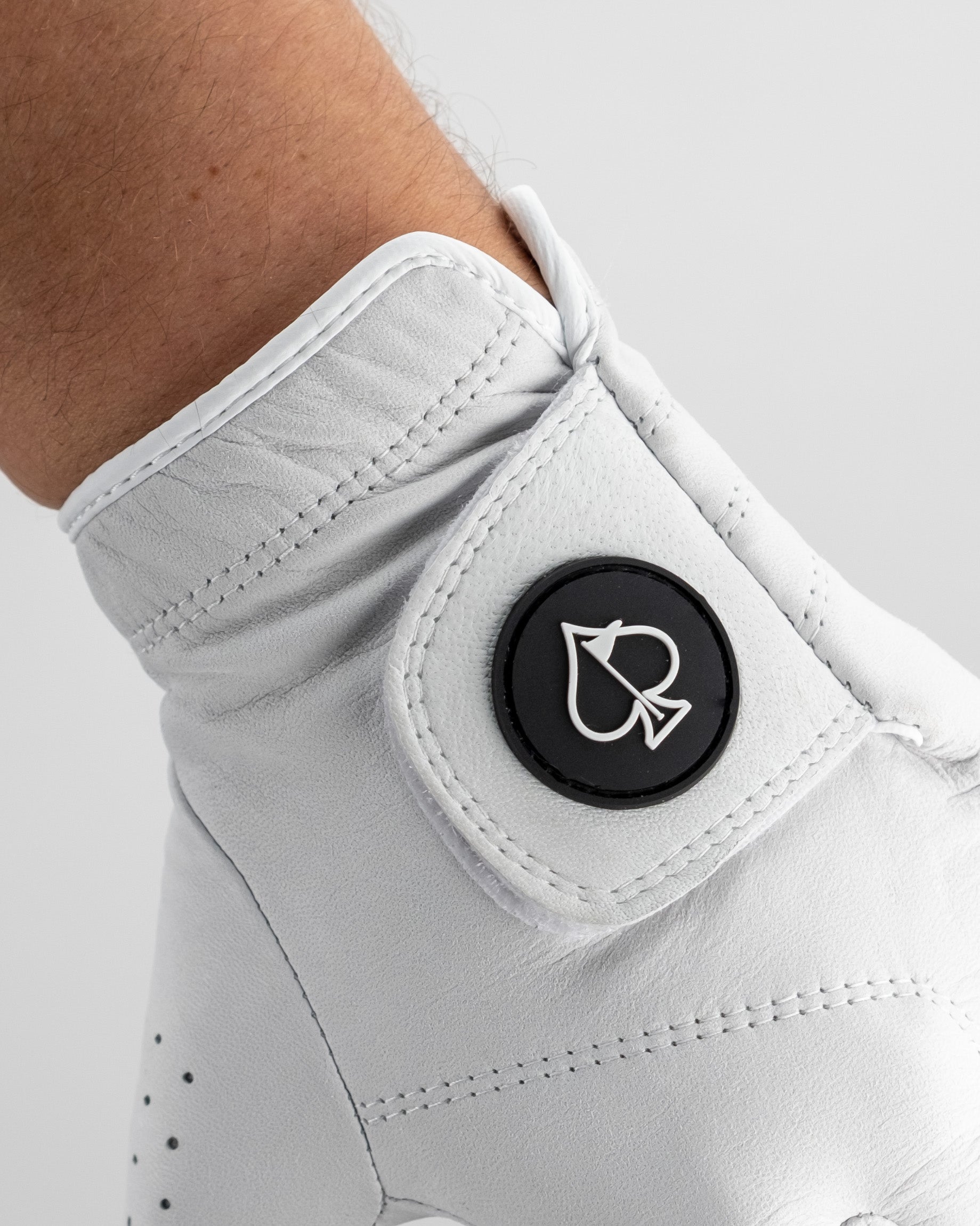 Premium Tour Glove in Ghost White with detailed stitching and breathable fabric design.