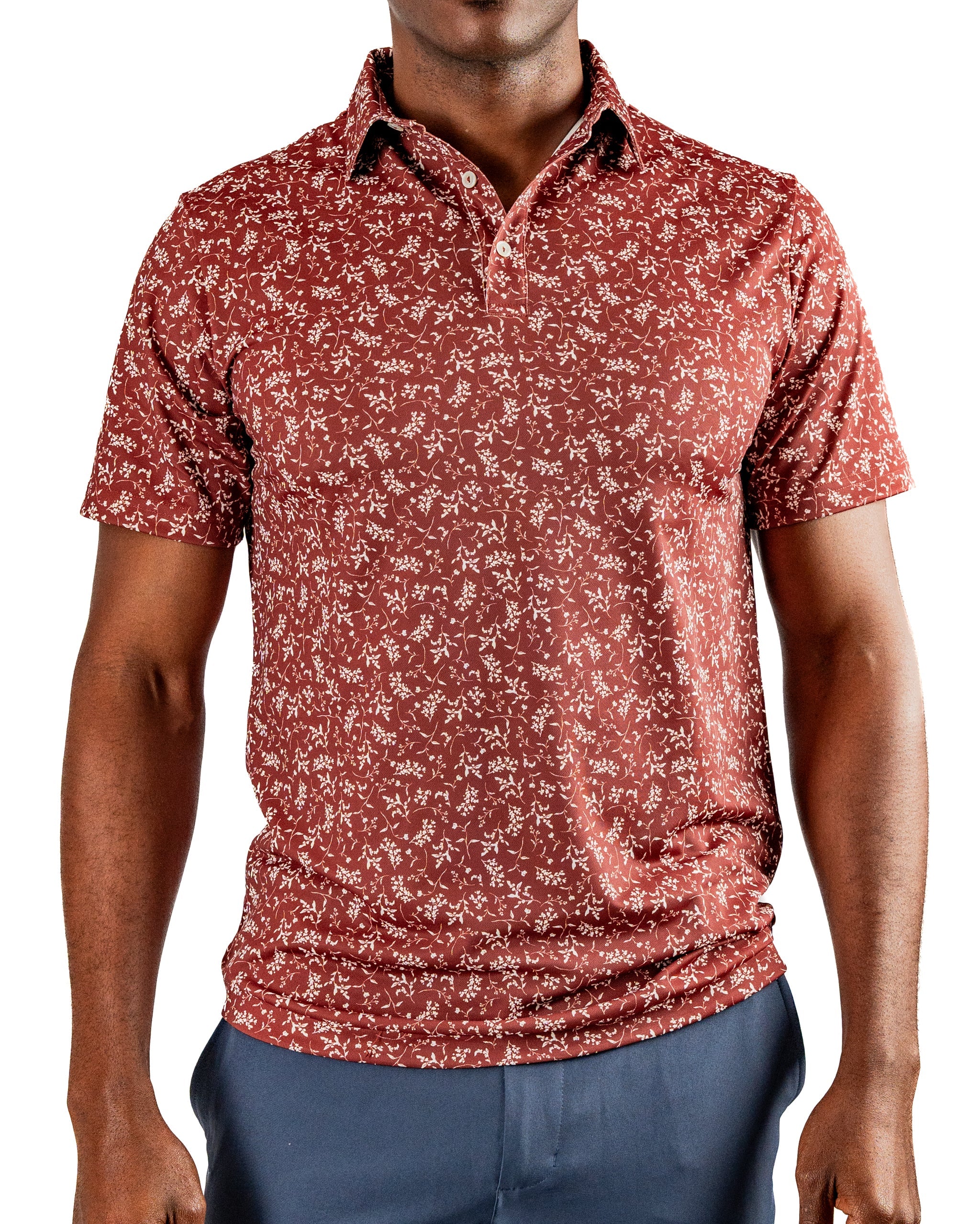 Men's short-sleeve golf polo in a rich maroon with a delicate floral pattern, perfect for stylish play on the course.