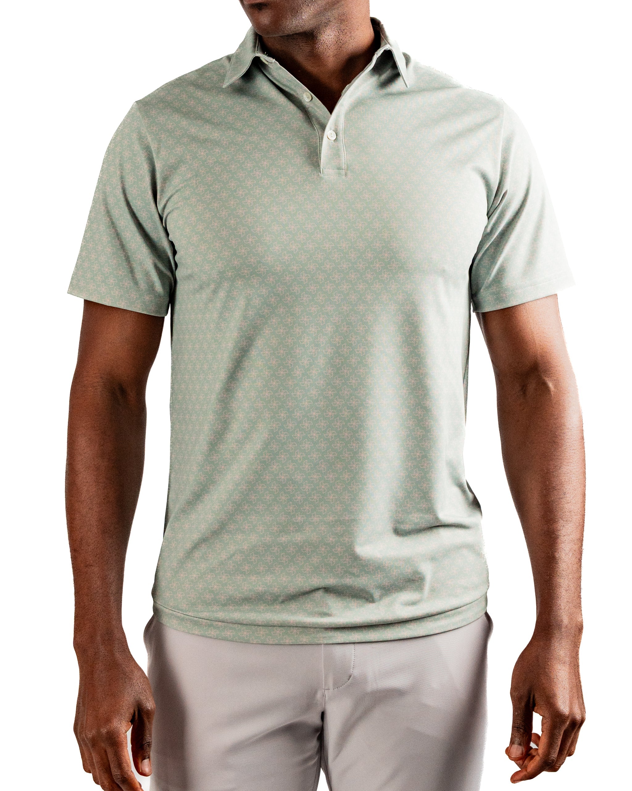 Men's short-sleeve golf polo in mint green with a subtle origami pattern, designed for comfort and style on the course.