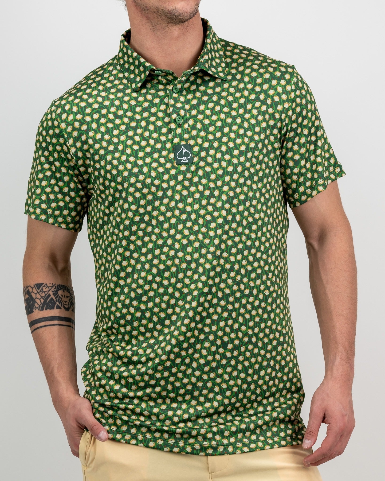 Men's green polo shirt featuring a playful pimento pattern, perfect for stylish golfers looking to stand out on the course.