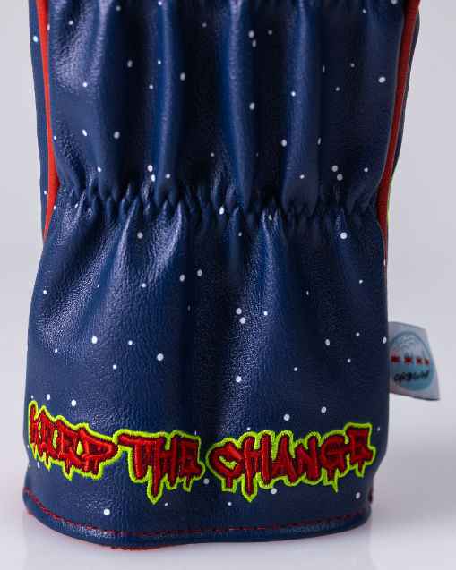 Bold blue driver cover featuring a playful design with "Keep the Change" in vibrant, graffiti-style lettering.