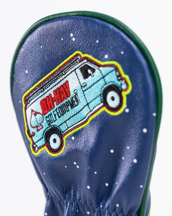Navy fairway cover featuring a colorful embroidered design of a van with a playful logo for golf enthusiasts.