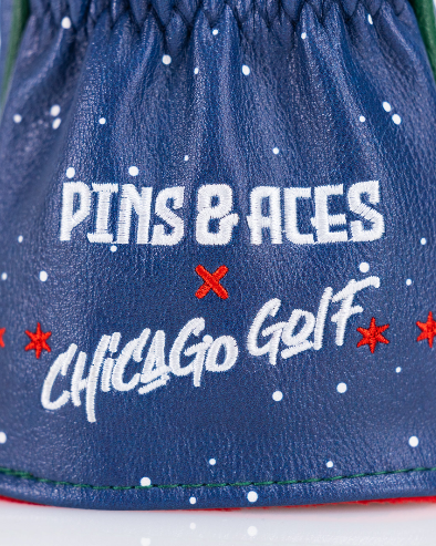 Navy fairway cover featuring "Pins & Aces" and "Chicago Golf" embroidered in vibrant colors, perfect for stylish golfers.