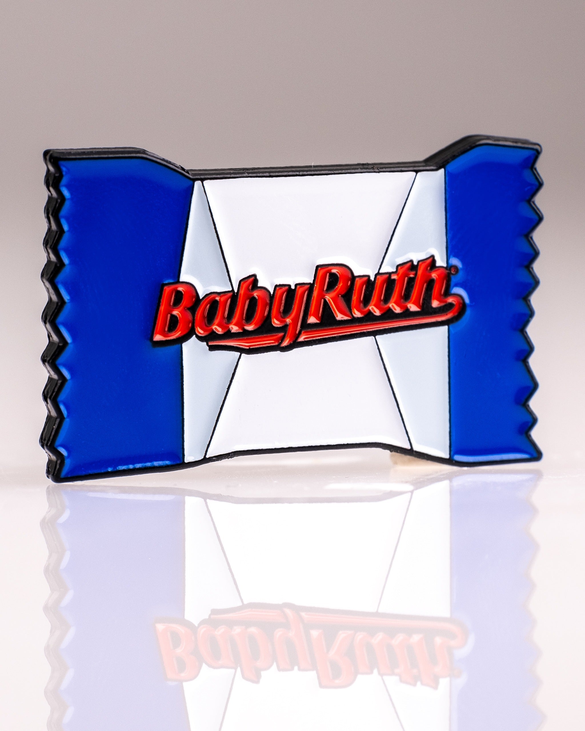 Colorful Baby Ruth ball marker featuring the iconic candy wrapper design, perfect for adding fun to your golf game.