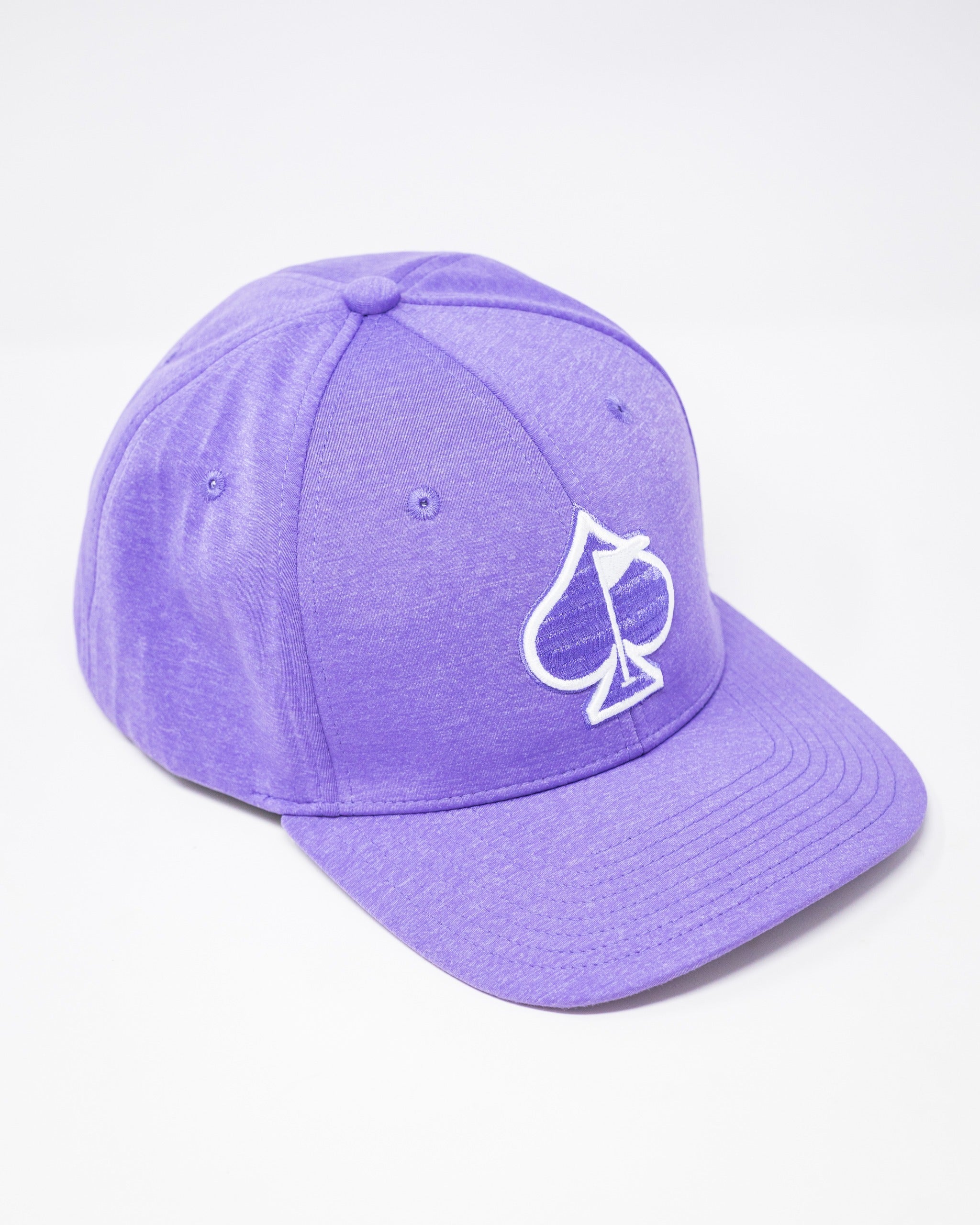Lavender performance hat featuring a white spade logo, designed for stylish golfers seeking comfort and flair.