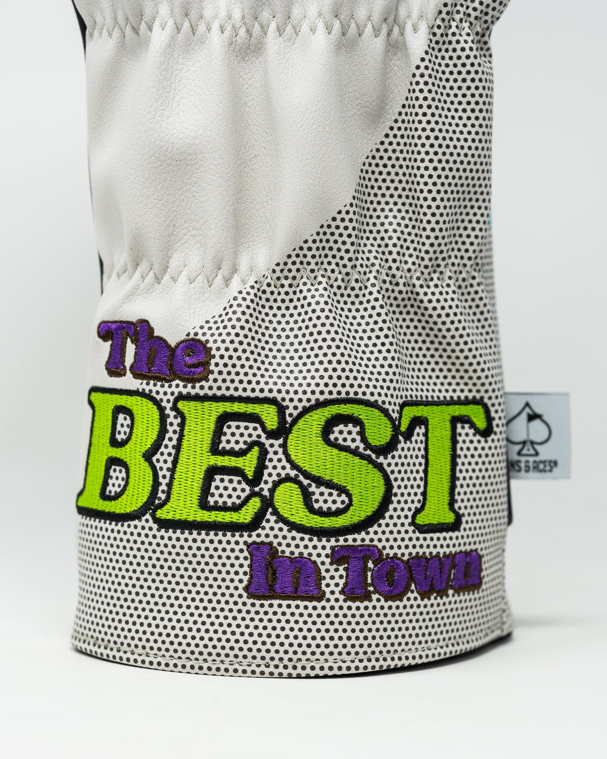 Bold golf driver cover featuring a stylish design with the phrase "The BEST In Town" in vibrant colors. Perfect for standout golfers.